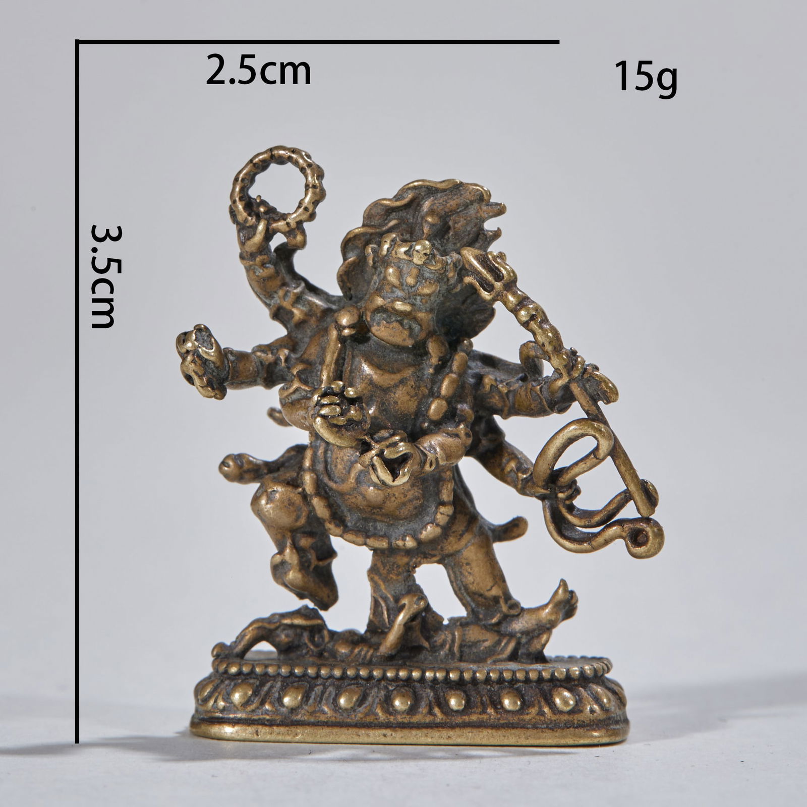 Bronze-Bodied Six-Armed Mahakala Small Buddha: Bronze Body Six-Armed Mahakala Miniature Buddha, height 3.5cm, length 2.5cm, width 1cm, red copper gilded. Made using the lost-wax casting method, the six-armed Mahakala holds ritual implements, with