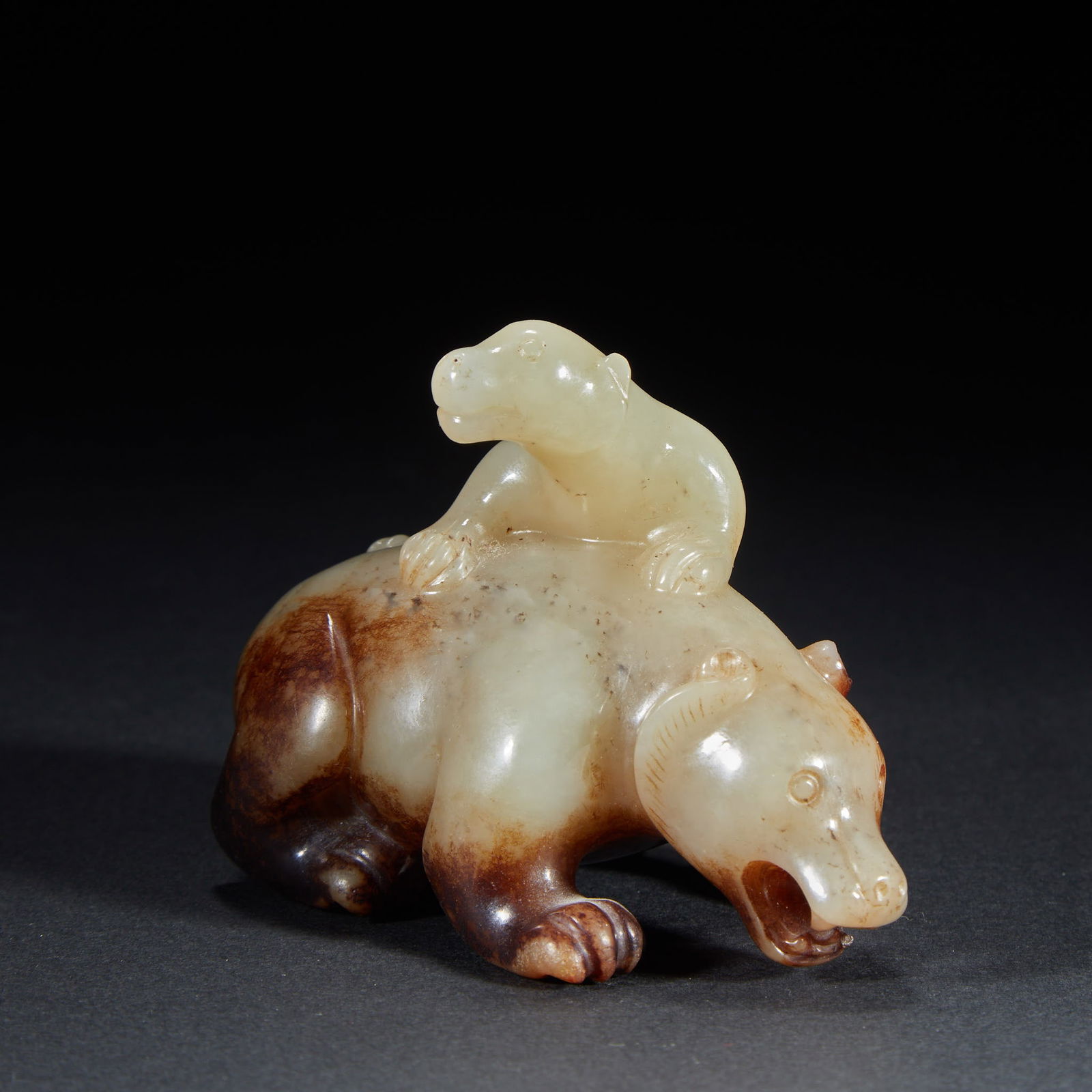 Mother and child beast ornament, Hetian jade: Hetian Jade Mother and Son Beast Carving | Han to Tang Dynasty (206 BC–907 AD) | Hetian bluish white jade (with natural reddish brown patina); round carving | H6.3cm×L8.8cm×W4.2cm; W:223g | Uneart
