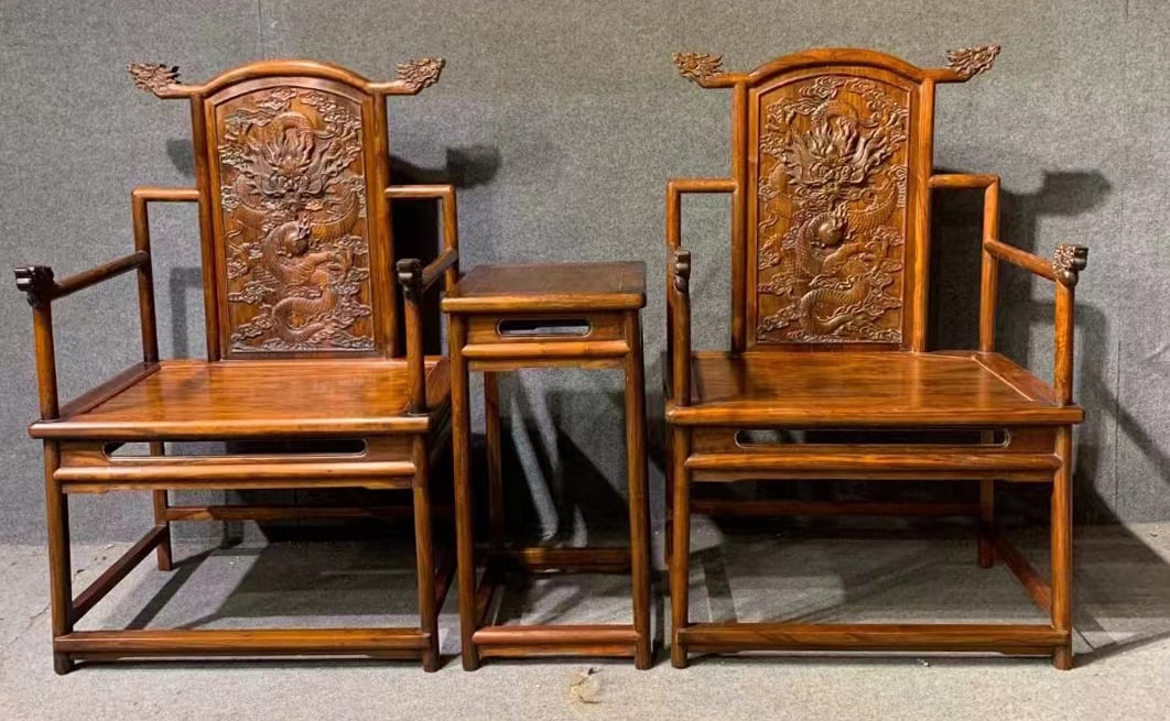 A three-piece set of official's hat chairs with dragon head design, Huanghuali wood: Huanghuali Dragon Head Official Hat Chair Set (3 Pieces) | Qing Dynasty, Mid-Period (1736–1820 AD) | Hainan huanghuali (old oil pear material, delicate grain, moist color); mortise and tenon