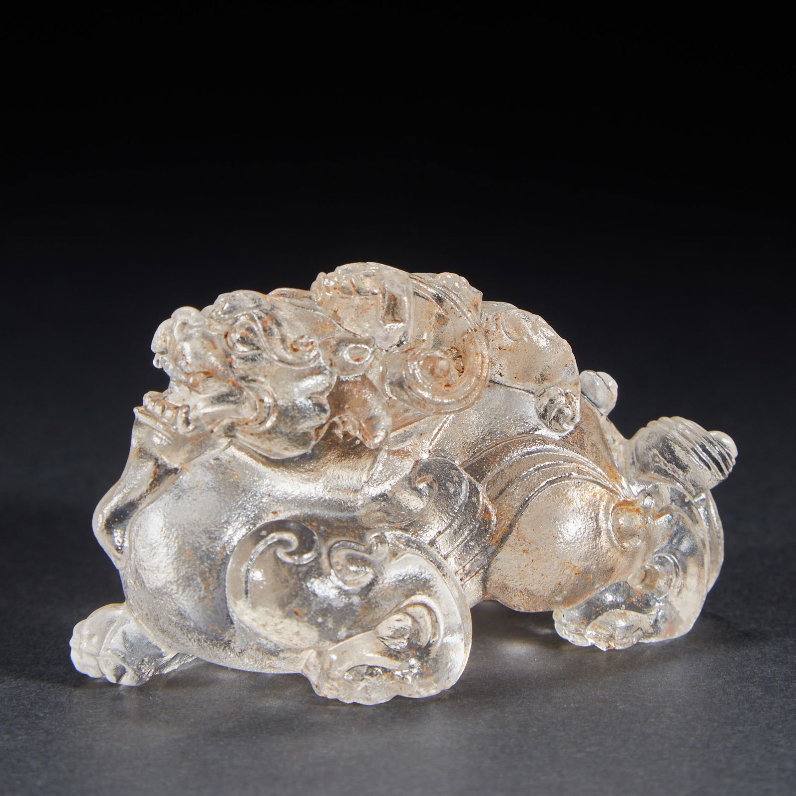 Auspicious beast ornament, crystal: Crystal Auspicious Beast, H: 4cm, L: 6cm, W: 3cm, 86g. Carved in Suzhou jade carving workshops in the Qing Dynasty, it was a paperweight or a handheld ornament for the study. Made of natural white