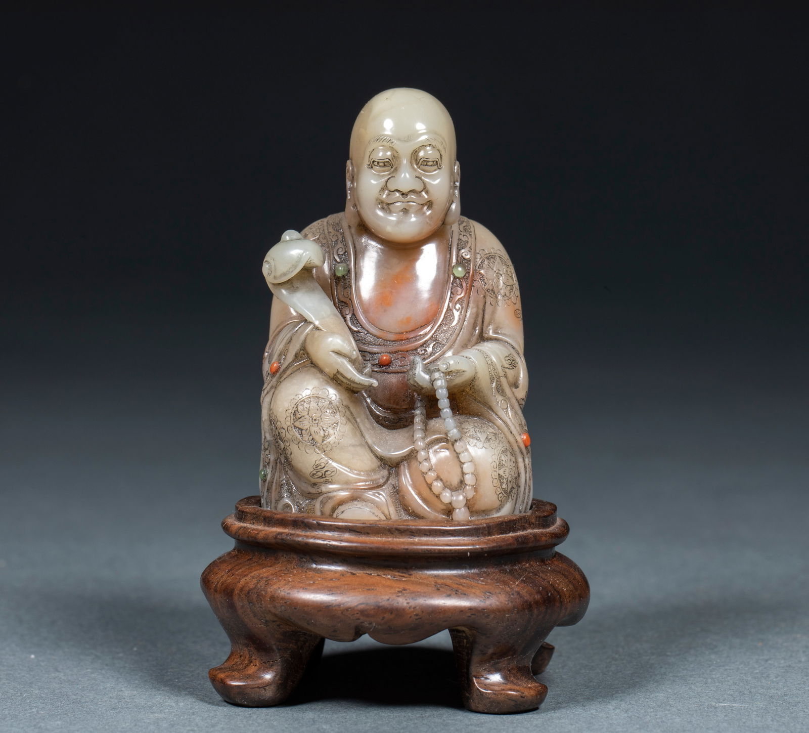 Arhat with Ruyi Ornament, Shoushan Stone: Shoushan Stone Ornament of Arhat Holding an Ruyi Scepter, 7cm in height, 4cm in length, 4cm in width and 130.5g in weight. Produced by a stone carving workshop in Fuzhou, Fujian in the mid-Qing
