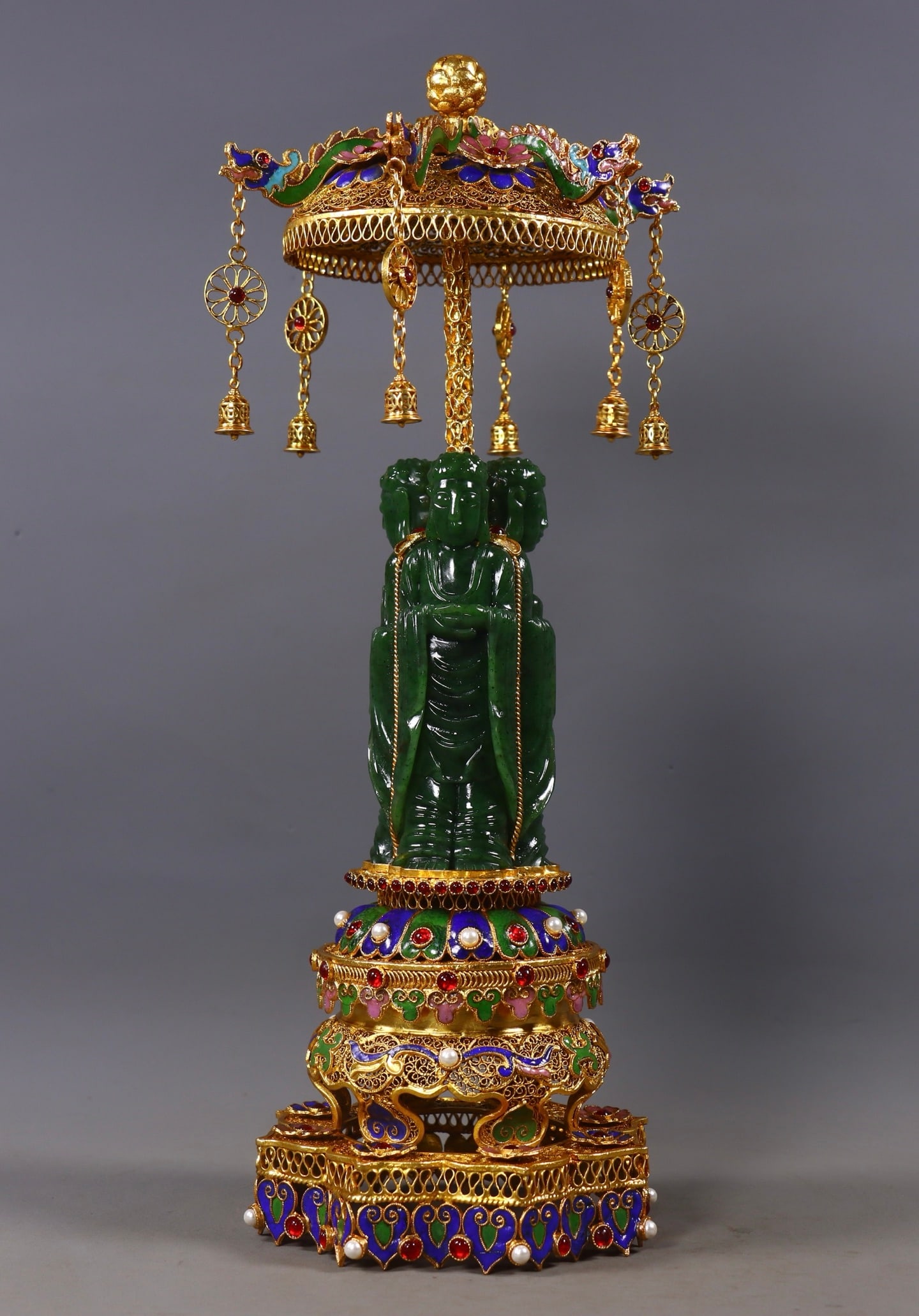 Three-Faced Buddha Statue, Hetian Green Jade with Gold Cladding: Hetian Jasper Buddha Statue with Three Faces and Gold Wrapping, 34cm in height, 13.5cm in diameter and 1136g in weight. Produced by the Imperial Workshop of the Qing Dynasty, it was a Tantric Buddha