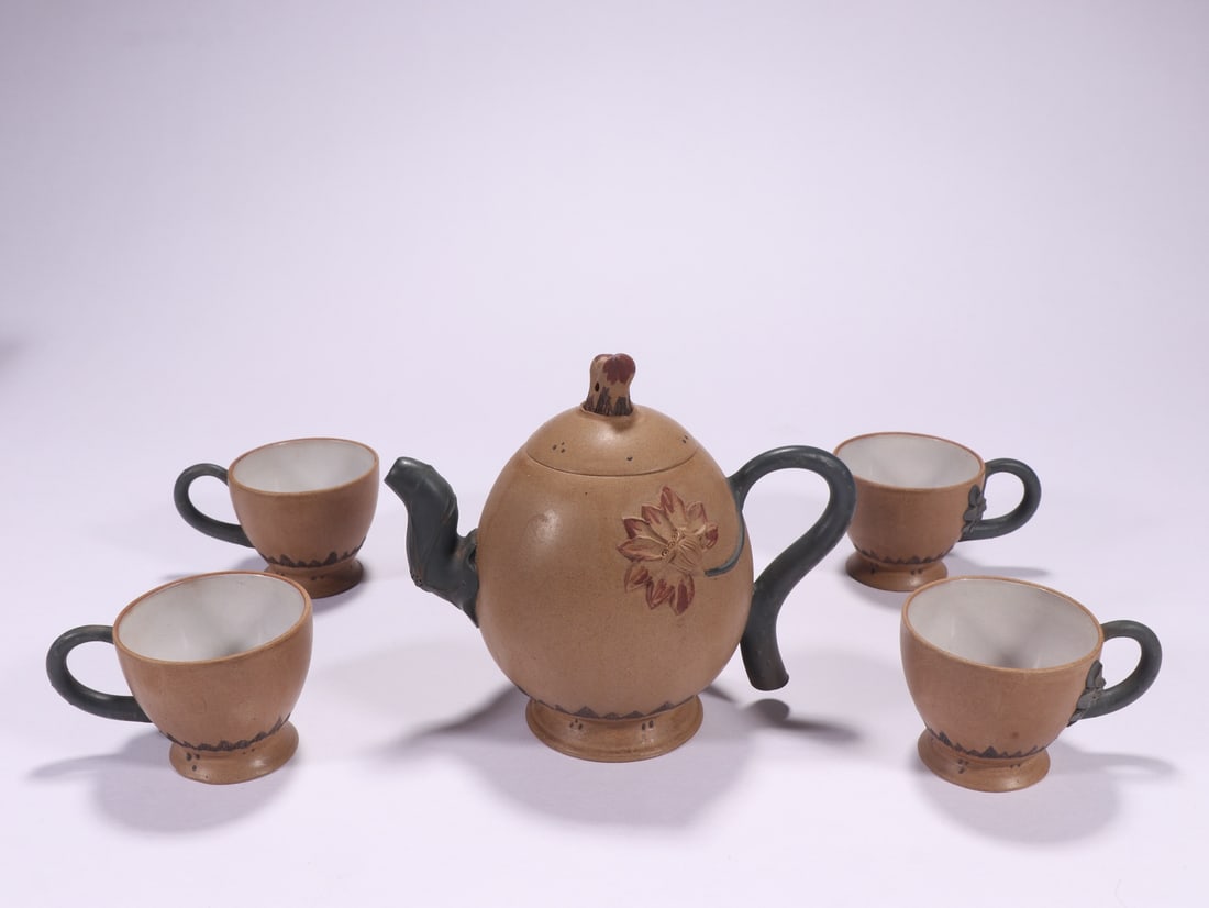 A Set of Yixing Zisha Duan Ni Teapots with Lotus Pattern, Marked Jiang Rong (1 of 9)