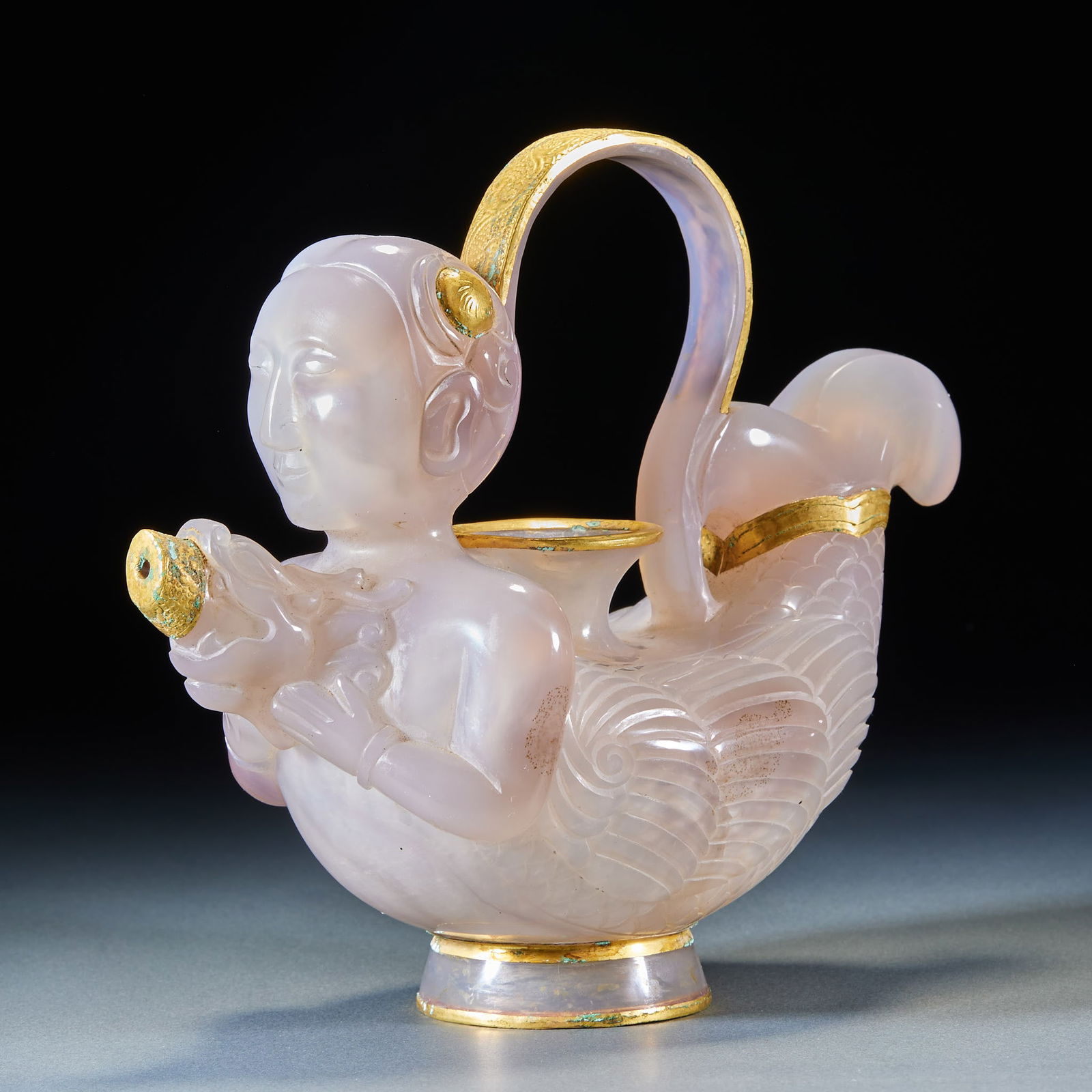 Ewer with Human Head and Fish Body, Agate with Bronze Cladding & Gold Gilding, Liao-Jin Period: Agate Ewer with Bronze Gilt Mount, Human Head and Fish Body Shape with Handle, Liao and Jin Dynasties, 17cm in height, 20.5cm in length, 10cm in width and 738g in weight, Produced by a Khitan