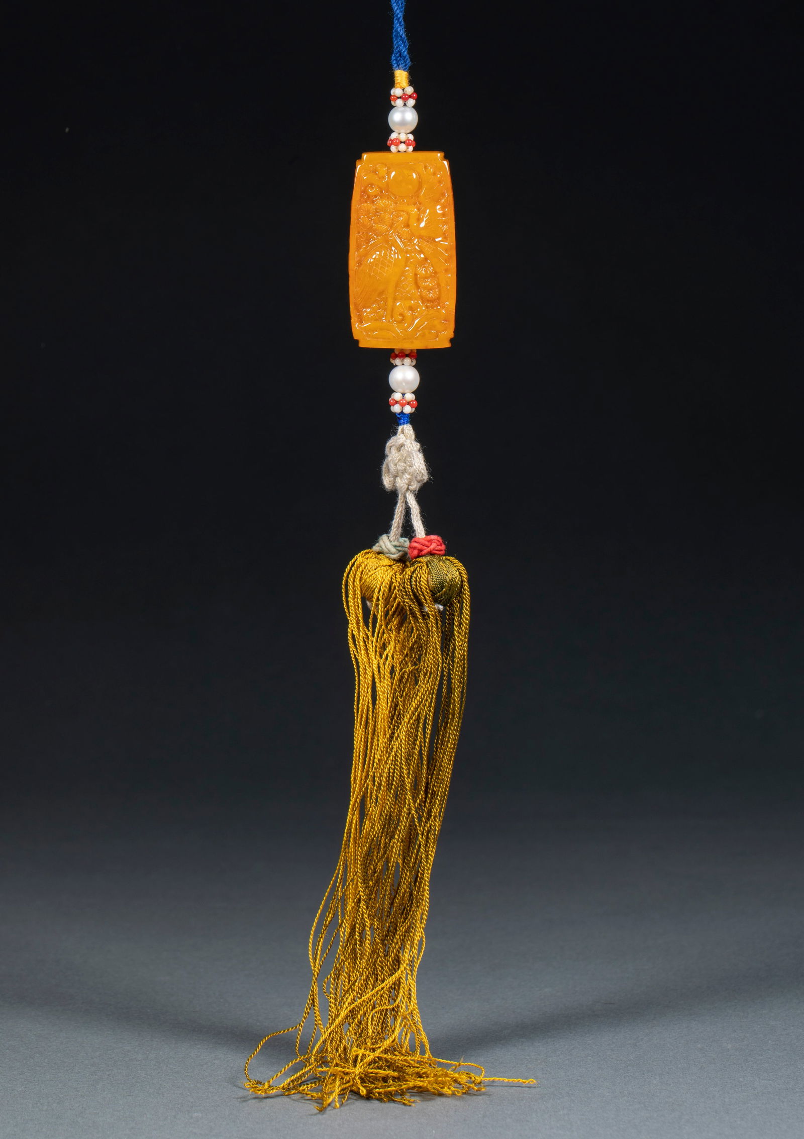 Waist Pendant with "Pine and Deer in Spring" Design, Amber: Beeswax Waist Pendant with Pine and Deer in Spring Design, 1.9cm in thickness, 5cm in length, 2.8cm in width and 30g in weight, Produced by the Imperial Workshop of the Qing Dynasty, it was one of the