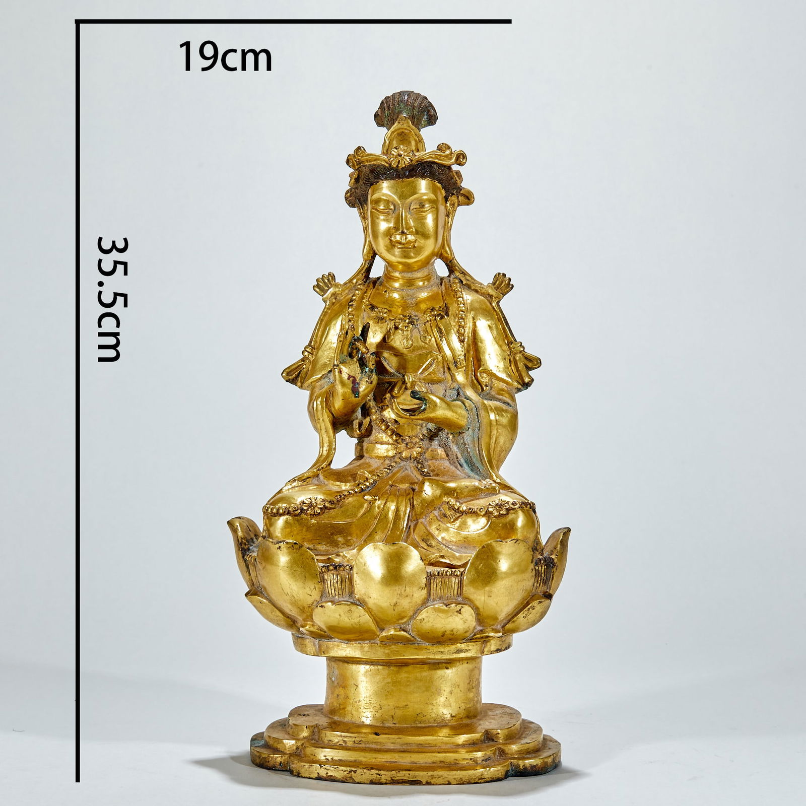 Gilt Bronze Seated Guanyin Buddha, Pre-Ming Dynasty: Gilt-Bronze Sitting Guanyin Statue Before the Ming Dynasty, with a height of 35.5 cm, length of 19 cm and width of 15 cm, a consecrated statue in the imperial court of the Yuan Dynasty or Jiangnan