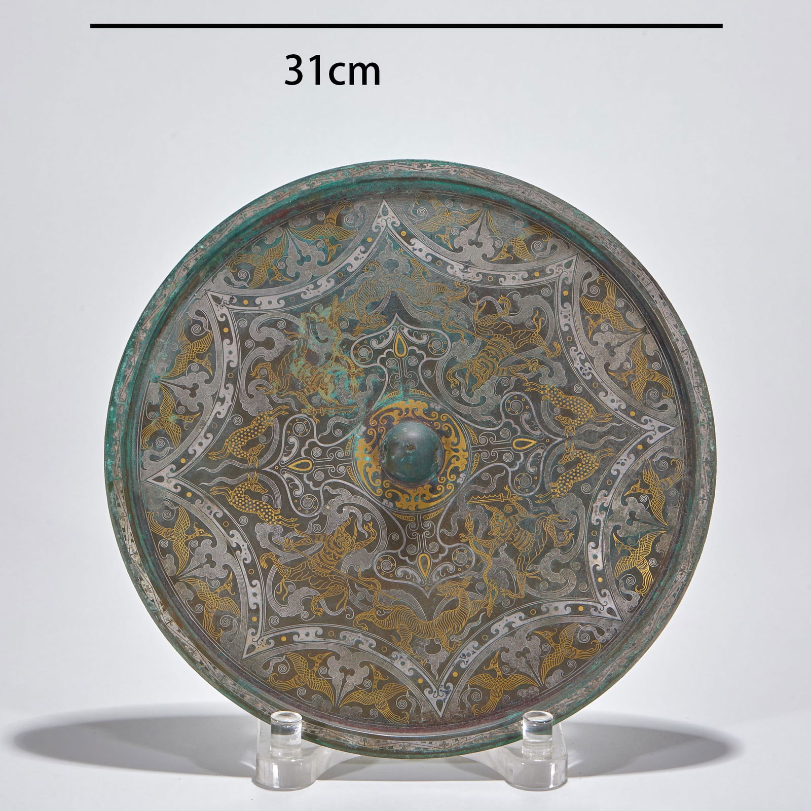 Gold and Silver Inlaid Bronze Mirror with Animal Pattern, Pre-Ming Dynasty: Gold and Silver Inlaid Bronze Mirror with Beast Pattern (Pre-Ming Dynasty), diameter 31 cm. An imperial bronze mirror of the Tang Dynasty, unearthed from noble tombs in the Chang'an area. The back of