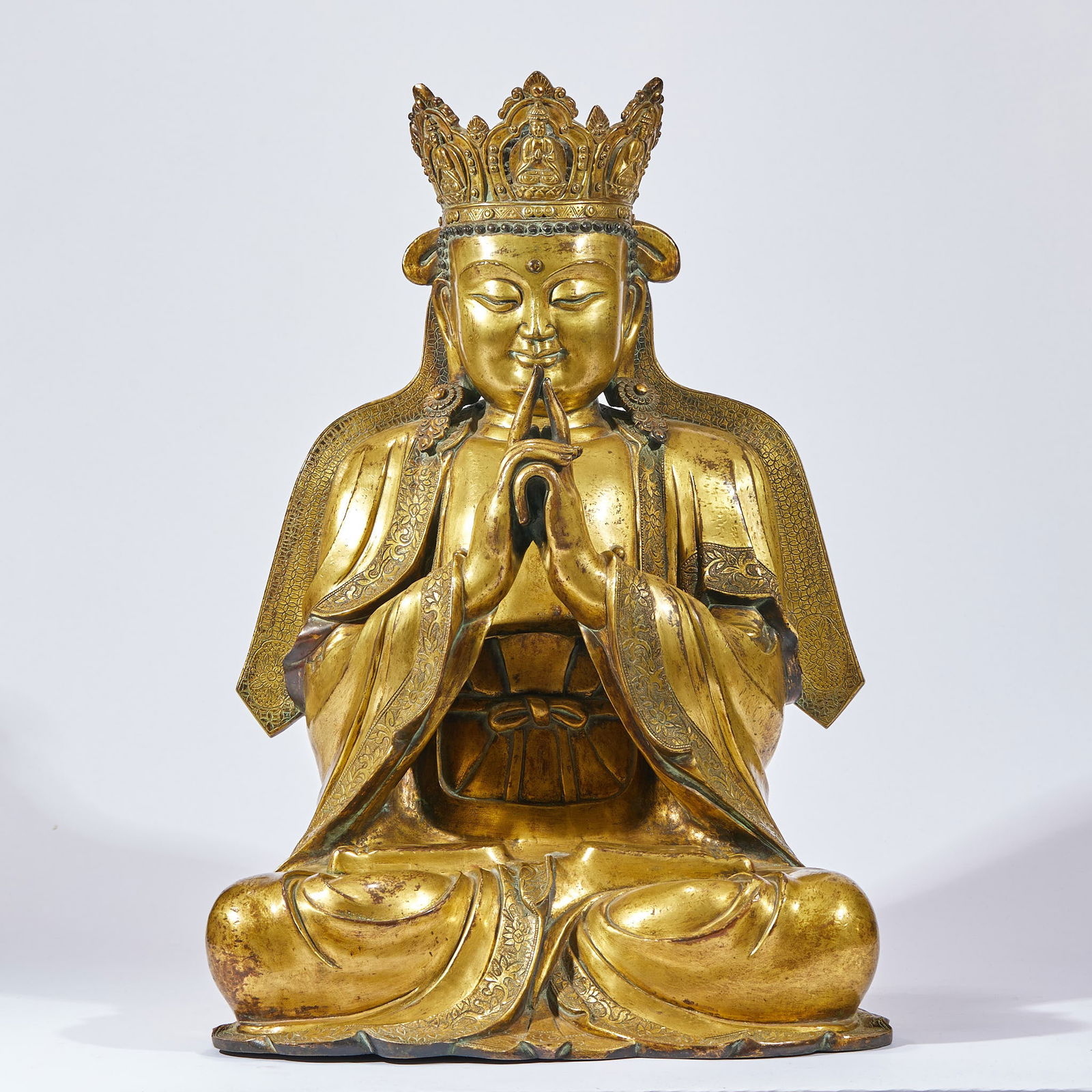 Gilt Bronze Mahavairocana Buddha Statue: Gilt-Bronze Vairocana Buddha Statue, height 55 cm, length 38.5 cm, width 32 cm. Crafted by the Imperial Workshop in the Yongle Period of the Ming Dynasty, a Tibetan Buddhist temple enshrined statue.
