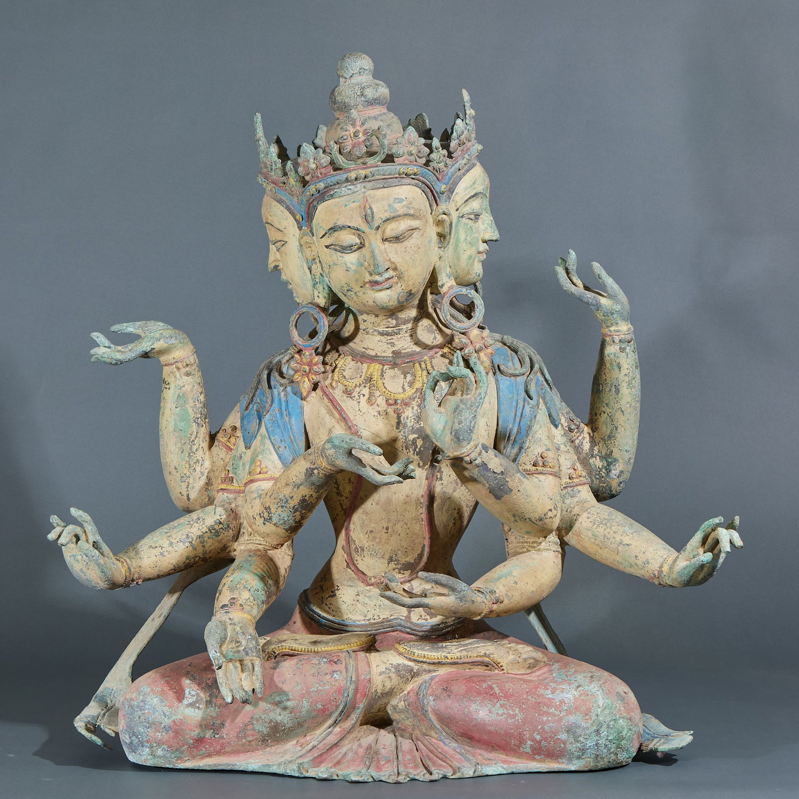 Polychrome Bronze Guanyin Buddha Statue with Four Heads and Eight Arms: Bronze Painted Four-Headed Eight-Armed Guanyin Buddha Statue, height 63 cm, length 61.5 cm, width 35 cm. Derived from the Tibetan Buddhist statue system, this type of multi-headed and multi-armed