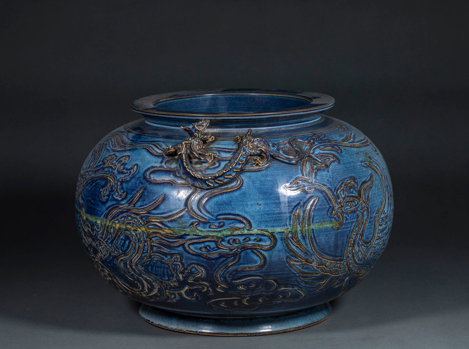 Large Blue Glazed Jar with Dragon and Phoenix Motifs, 10th–11th Century: A large blue-glazed dragon and phoenix pattern jar from the 10th to 11th century, 27 cm high and 38 cm in diameter.