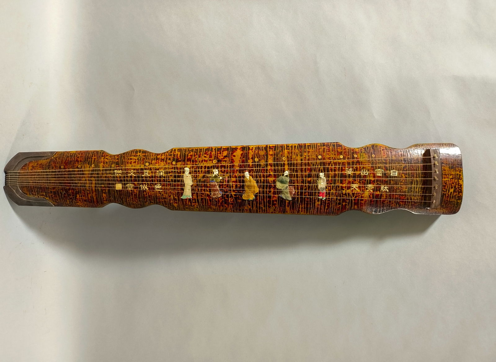 Lacquered Wood Guqin with Inlaid Figure Paintings and Inscribed Poems: Lacquer, Wood Base, Inlaid Figures, Poem, Guqin, Length: 122 cm, Width: 20 cm