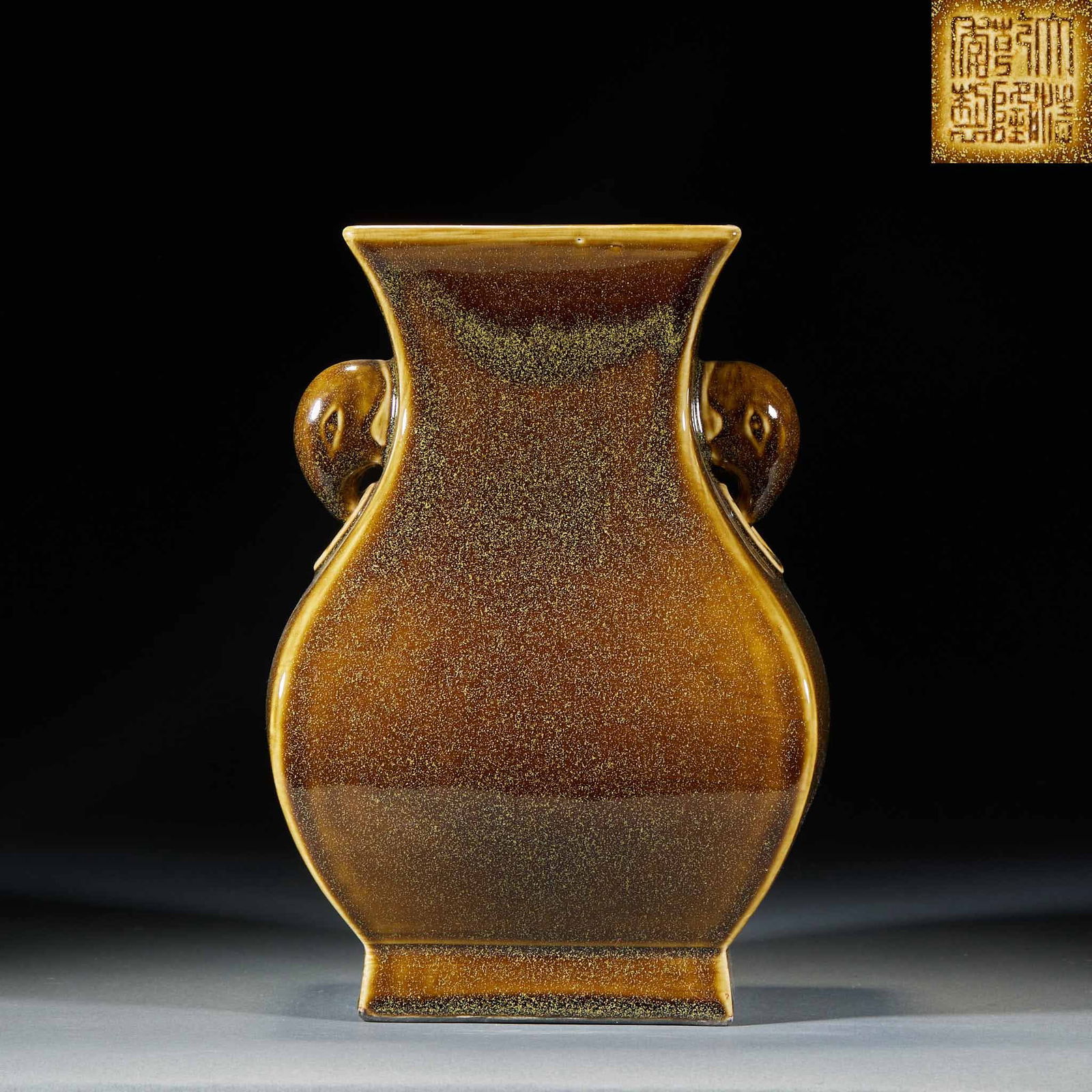 Eel Yellow Glaze Elephant Ear Vase: Eel-yellow glazed elephant-ear zun. Height 23.5cm, length 16cm, width 13cm. Official kiln product of Jingdezhen, Qing Dynasty, marked with 'Made in the Qianlong reign of the Qing Dynasty'. Kaolin