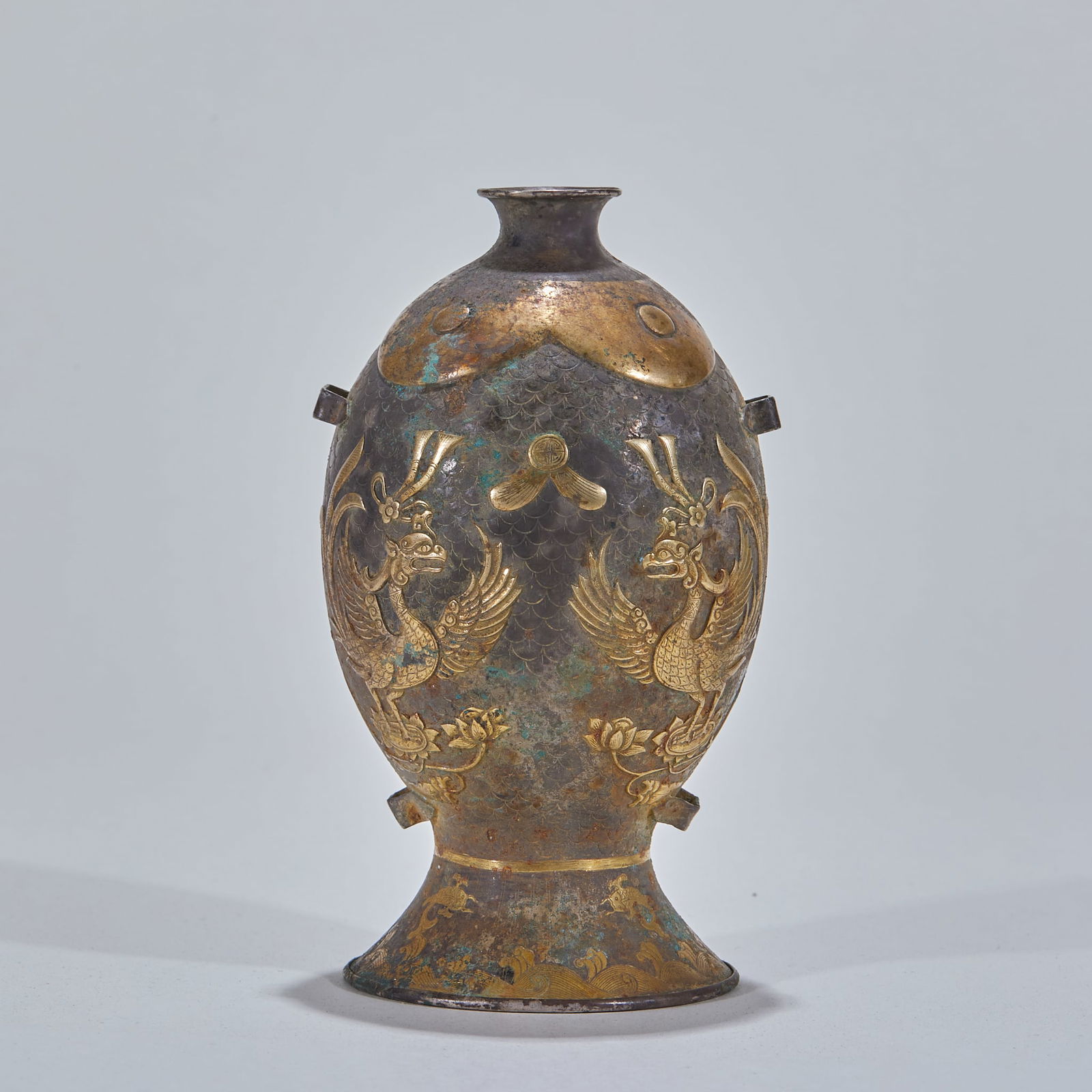 Silver gilt with phoenix pattern bottle: Pure silver gilded phoenix vase. Height 12.5cm, diameter 7.5cm, weight 150g. Originated from Tang silverware, a fine Qing archaistic silverware. Pure silver body fully gilded (partial gilding loss),
