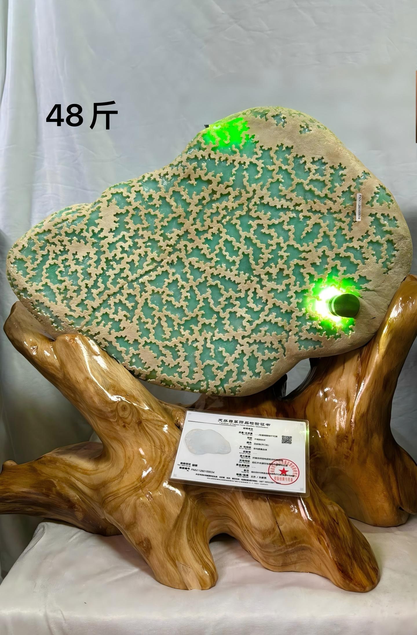 A-grade full green jadeite rough stone: Grade A full-green jadeite rough stone. Weight 24000g. Modern jadeite market, marked '48 jin', polished ornamental rough from Myanmar mines (not natural raw material). Jadeite rough or similar