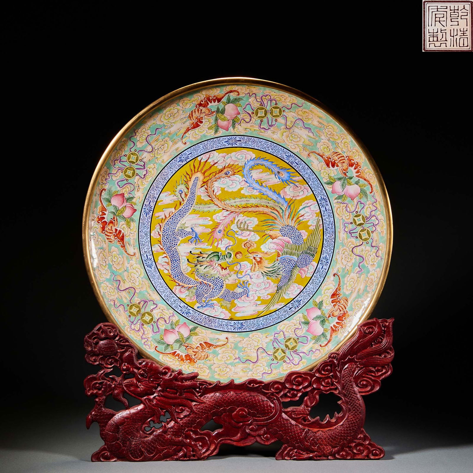 Qing Dynasty Qianlong period painted enamel "Dragon and Phoenix Playing with the Pearl" "Happiness,: Qianlong Painted Enamel Dish: Dragon and Phoenix Presenting Blessings. Height 4.5cm, diameter 38cm, weight 1897g. Made by the Qing Imperial Workshop in Qianlong period for imperial reward or display.