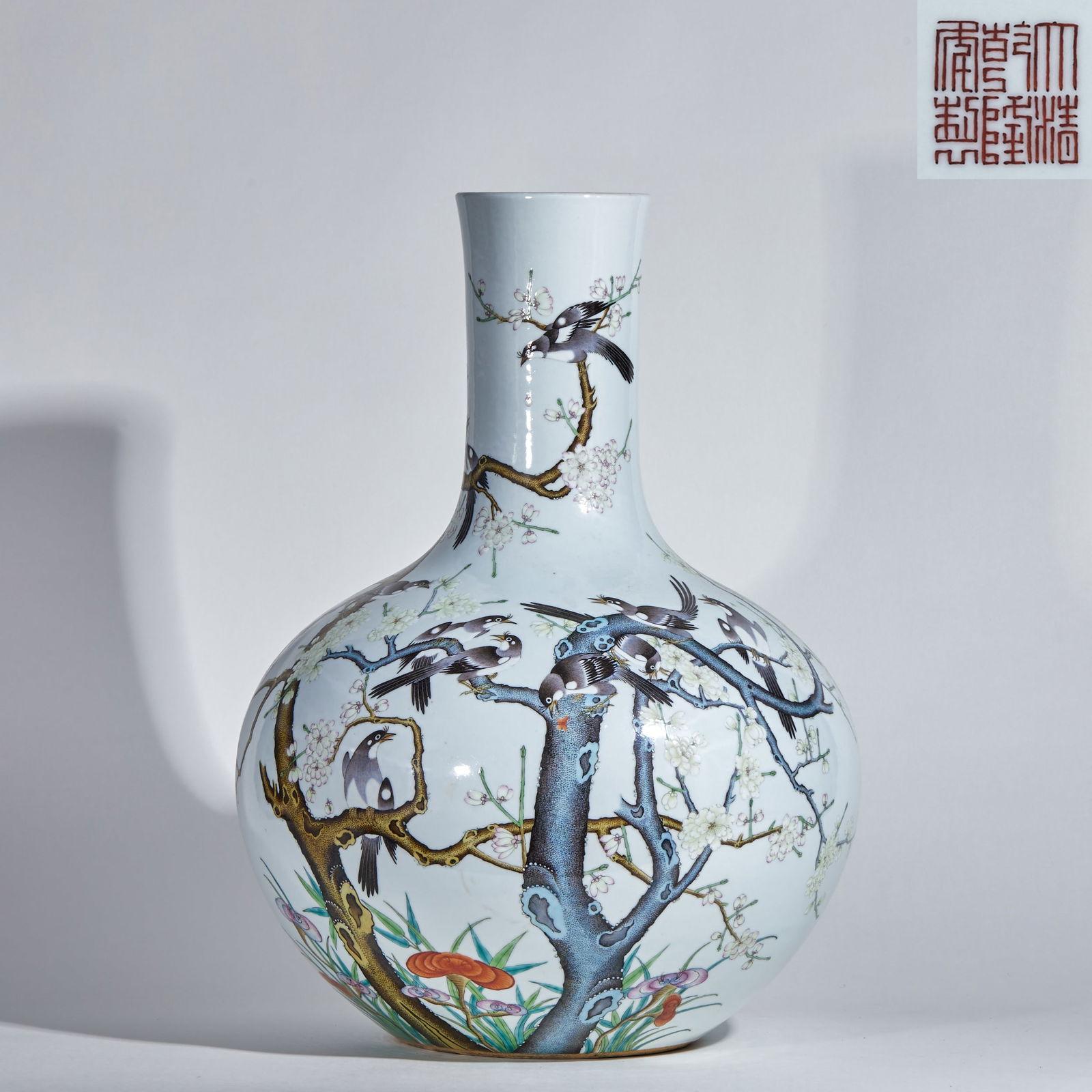 Qianlong period (1736-1795) polychrome porcelain vase with magpies on plum blossoms: Qing Dynasty, Qianlong Period. Powdered-color glazed teapot vase, height 52 cm, diameter 36 cm. Made by the official kiln of Jingdezhen during the Qianlong period, it was a piece for the imperial