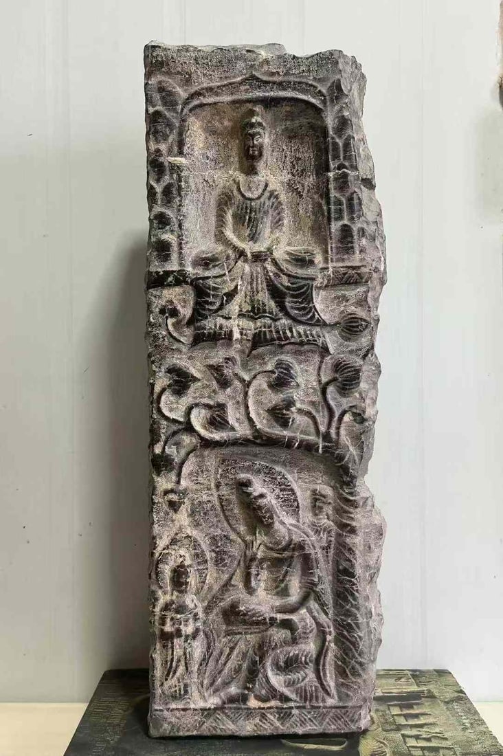 Fragment of a Qing stone Buddha niche from the Northern Wei Dynasty: A fragment of a blue stone Buddha niche from the Northern Wei Dynasty (386 - 534 AD), measuring 48 cm in height, 17 cm in length and 8 cm in width. It is a relic from the statues in large grottoes