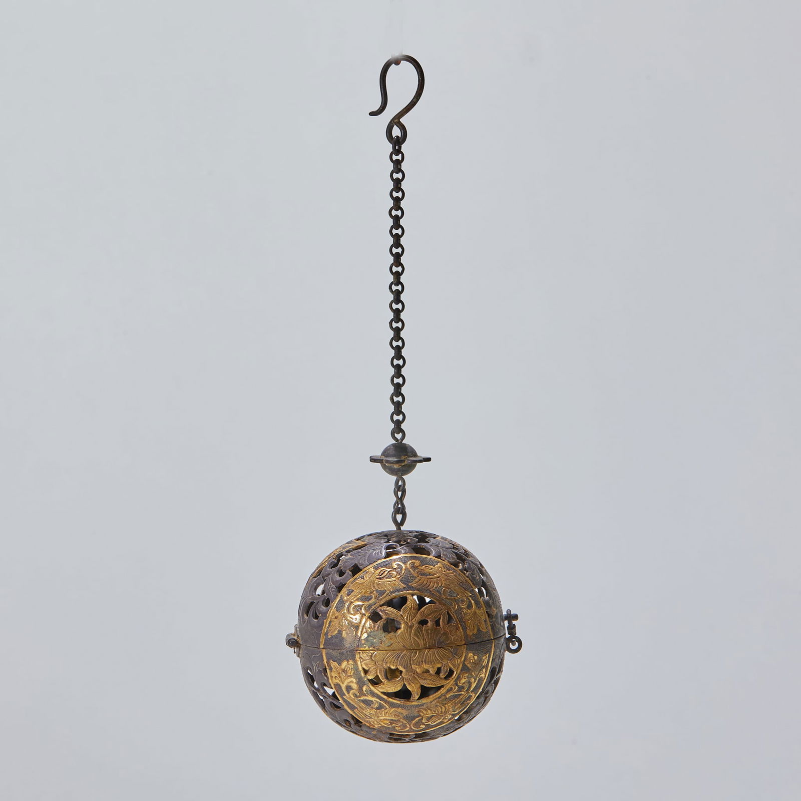 Pure Silver Gilded Sachet with Floral Pattern: Pure silver with gilding, floral pattern. The sachet has a diameter of 6 cm and weighs 107 grams. It is a piece of imperial incense set from the Tang Dynasty (or the Liao and Jin periods), influenced