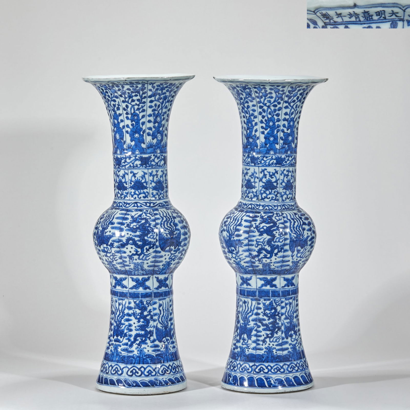 A Pair of Blue and White Flower Vases with Dragon and Phoenix, Jiajing Period, Ming Dynasty: Jiajing Mark Blue and White Vases with Dragon and Phoenix Patterns (Pair), height 61cm, diameter 22cm. A pair of court ornaments made in the Jingdezhen official kiln during the Jiajing reign, Ming