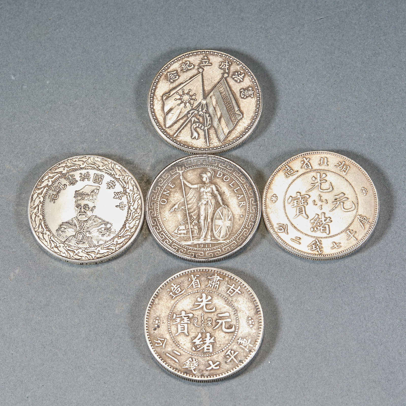 A Group of Five Silver Dollars: Set of Five Silver Dollars, diameter 4cm, 135g. Circulating or commemorative silver coins from the late Qing to Republican period, including Guangxu Yuanbao from Hubei and Gansu, Hongxian