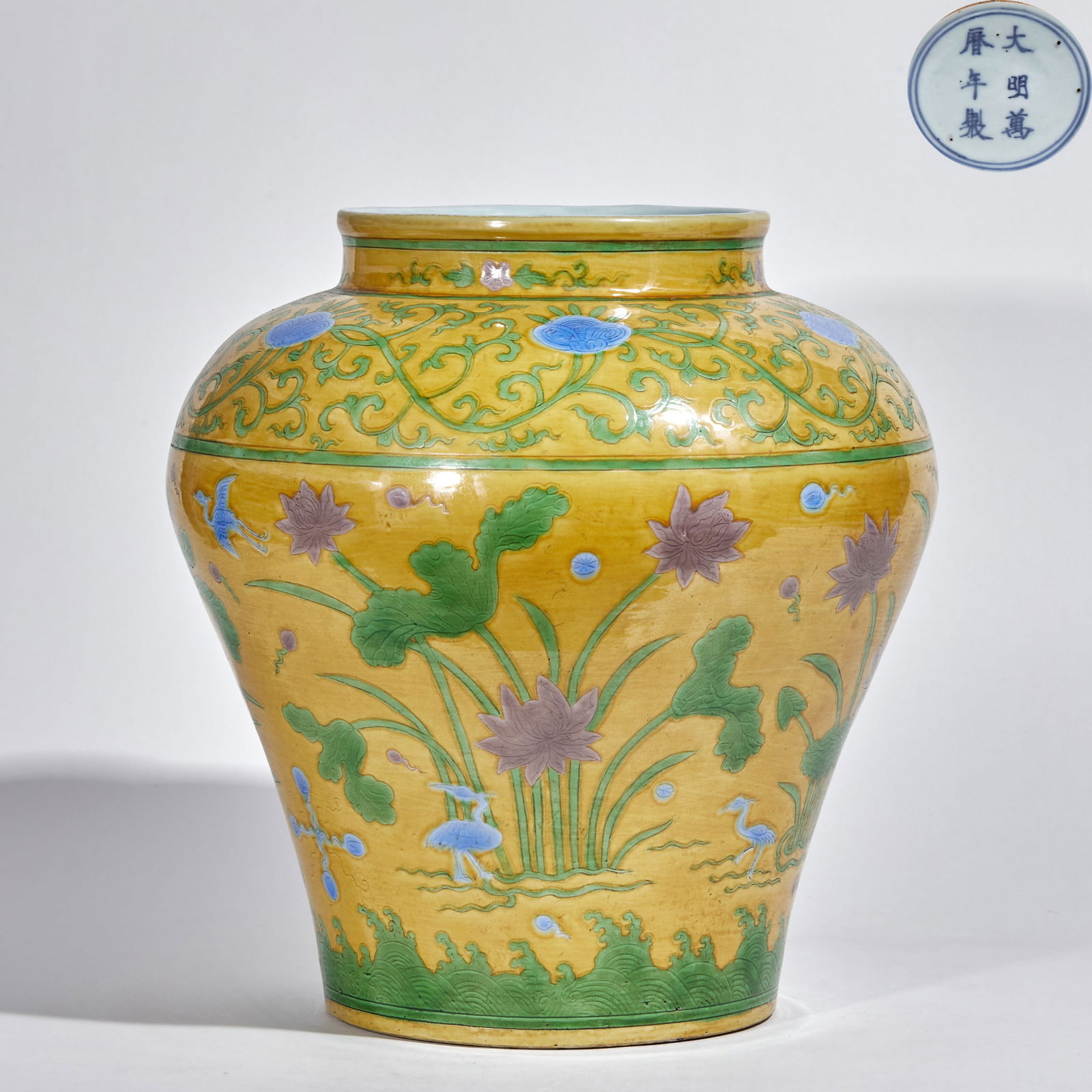 Sancai Jar with Lotus Pond and Cranes on Yellow Ground, Wanli Period, Ming Dynasty: Wanli Yellow?Ground Three?Color Lotus Crane Jar, height 36cm, diameter 33cm. A Ming Wanli Jingdezhen official?kiln porcelain marked “Made in the Great Ming Wanli Period”. Porcelain with
