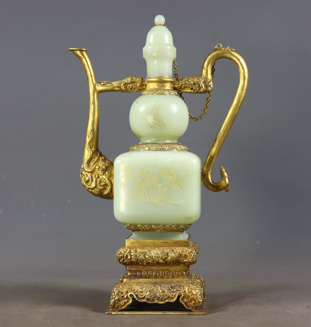 Hotan Jade Ewer Inlaid with Gilded Silver: Hotan Jade Inlaid Silver-Gilt Ewer, height 27cm, length 16.5cm, width 9cm, 886g. A court or noble wine vessel of the Qing Dynasty. Made of Hotan greenish-white jade, body inlaid with silver-gilt;