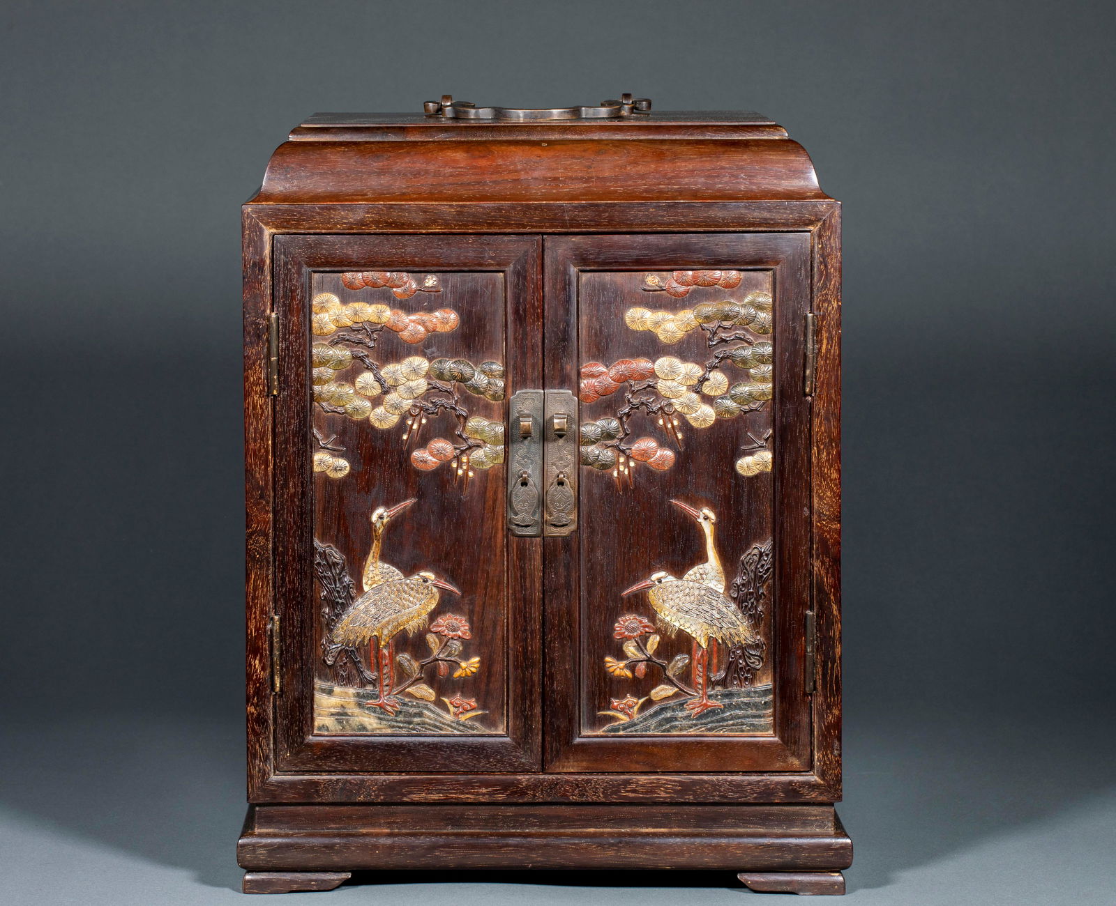 Small Leaf Zitan Curio Cabinet Inlaid with Jade: Small Leaf Rosewood Multi-Treasure Cabinet Inlaid with Jade, height 40cm, length 30cm, width 23cm. A literati cabinet of the Qing or Republican period, themed “pine and crane for longevity”. D