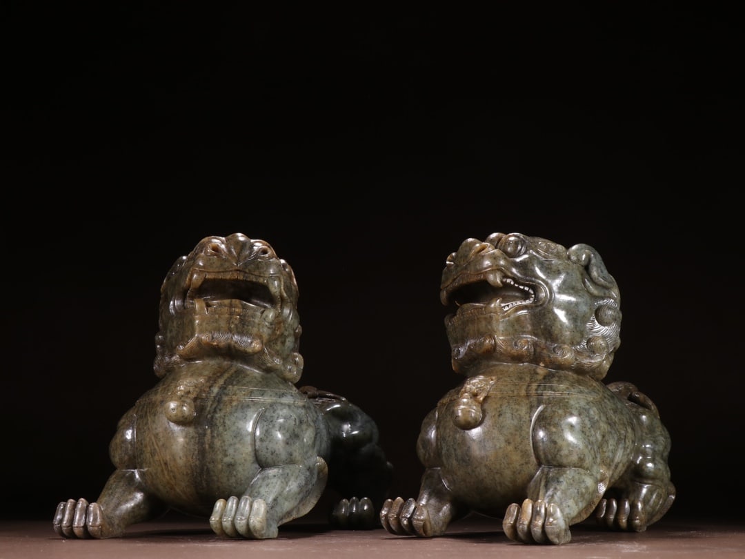 A Pair of Hotan Blue Seed Jade Lion Figurines, Qing Dynasty: Pair of Hotan Blue and White Seed Jade Lions, 20cm × 28cm