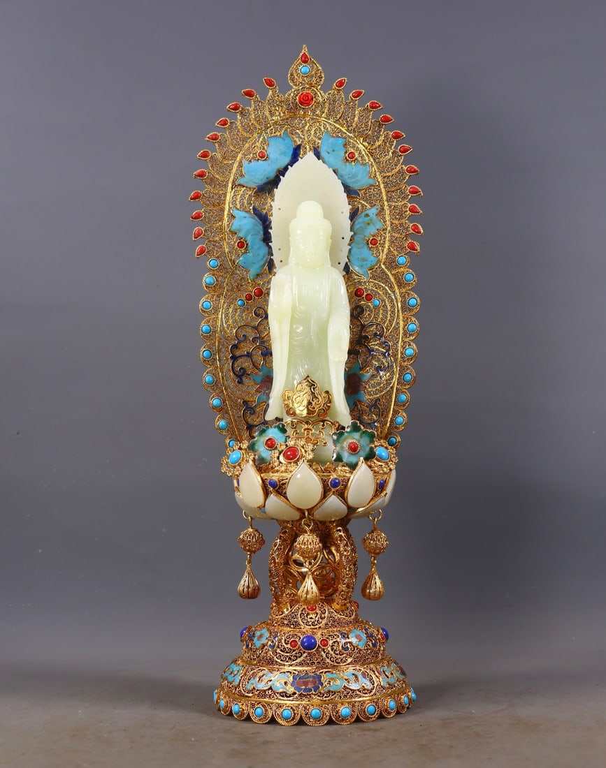 Filigree Gilded Inlaid Hetian Jade Buddha Statue: Filigree Gilt Inlaid Hetian Jade Buddha Statue, Height 38cm, Length 12.5cm, Width 11cm, 1057g. A ritual vessel from Qing imperial workshop or Tibetan Buddhist temple integrating Han-Tibetan craftsmans