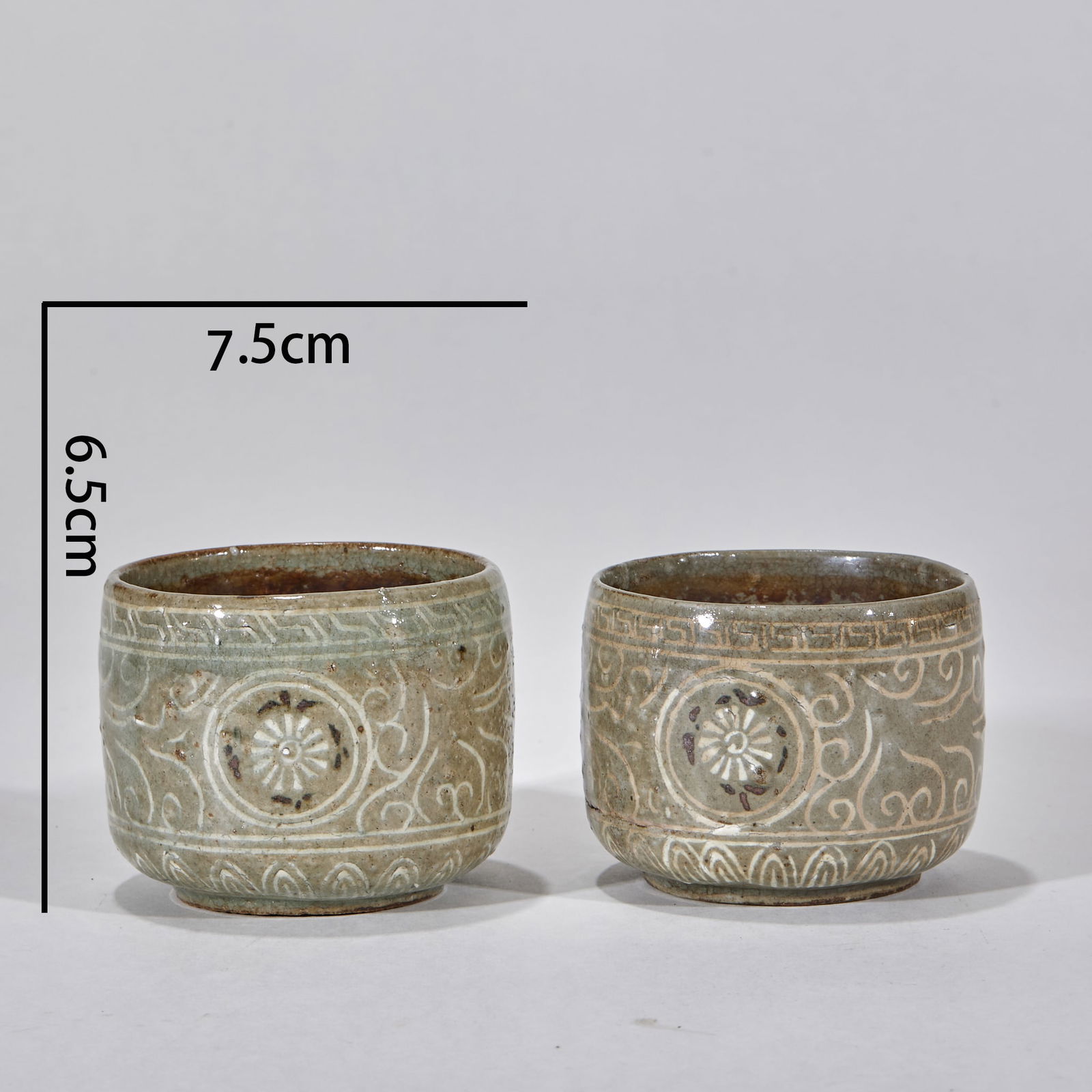 Pair of Koryo Celadon Cups: Pair of Goryeo Celadon Cups, Height 6.5cm, Length 7.5cm, Width 7.5cm. Imperial porcelain of the Goryeo Dynasty (Korean Peninsula) deeply influenced by Chinese Song Dynasty celadon. Kaolin body with