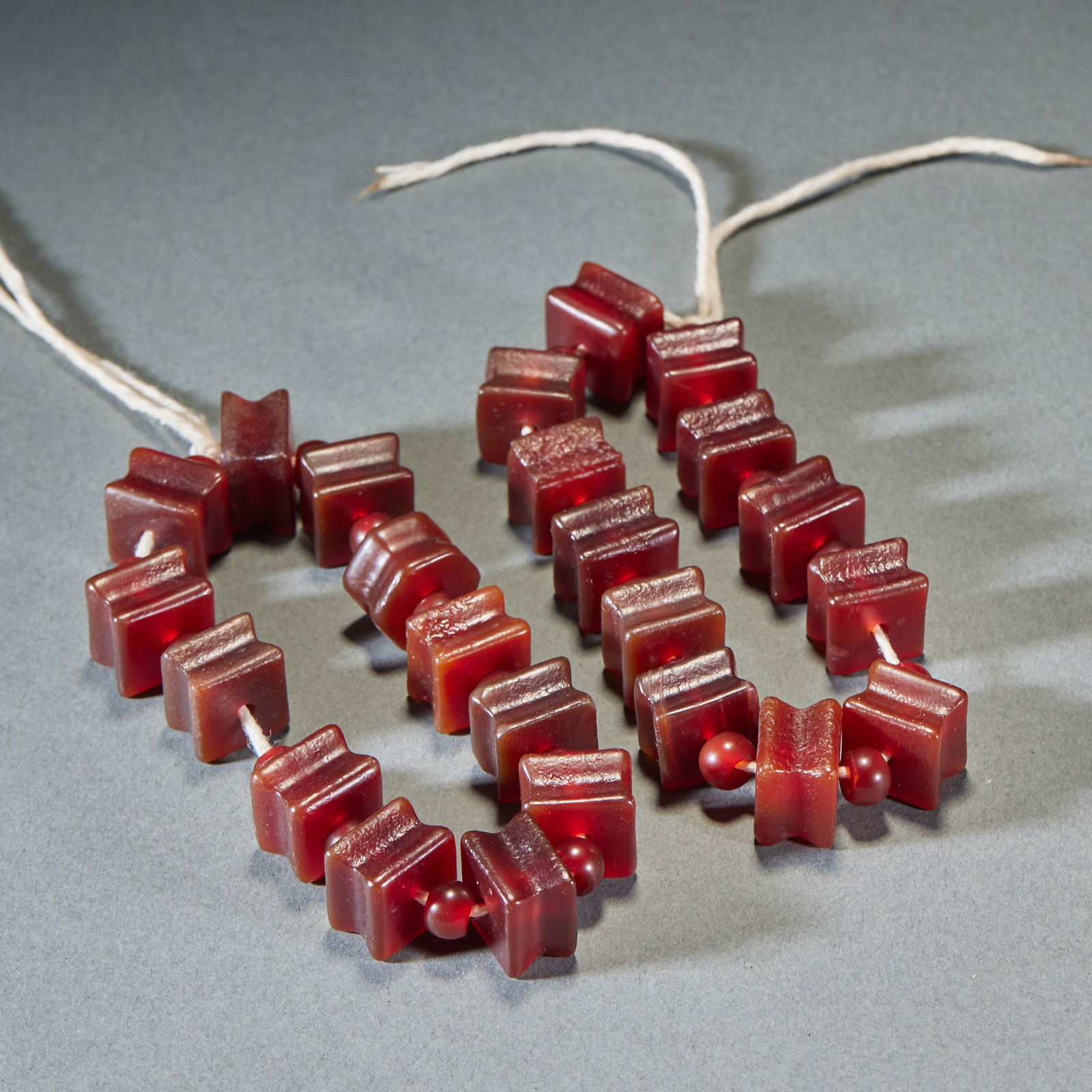 Pair of Agate Bracelets with Waisted Four-Edged Beads: Pair of Agate Waisted Four-Edge Bead Bracelets, bead length 1.5cm, width 1.1cm. Ancient ornament accessories often used in noble pendant sets or Tibetan Buddhist prayer beads, symbolizing “stable an