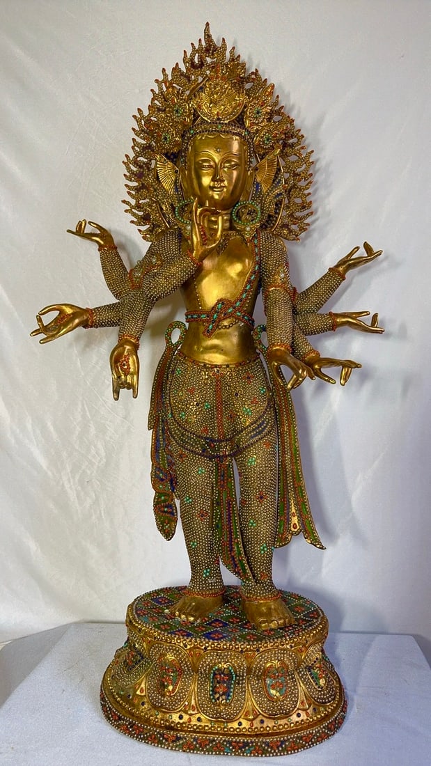 Gilded Eight-Armed Guanyin Fully Inlaid with Pearls, Turquoise, Coral and Lapis Lazuli: Gilded Eight-Armed Guanyin Fully Inlaid with Pearls, Turquoise, Coral and Lapis Lazuli, height 1.1m, width 58cm. Made by the Qing dynasty Imperial Workshop (Kangxi to Qianlong periods), mostly a treas