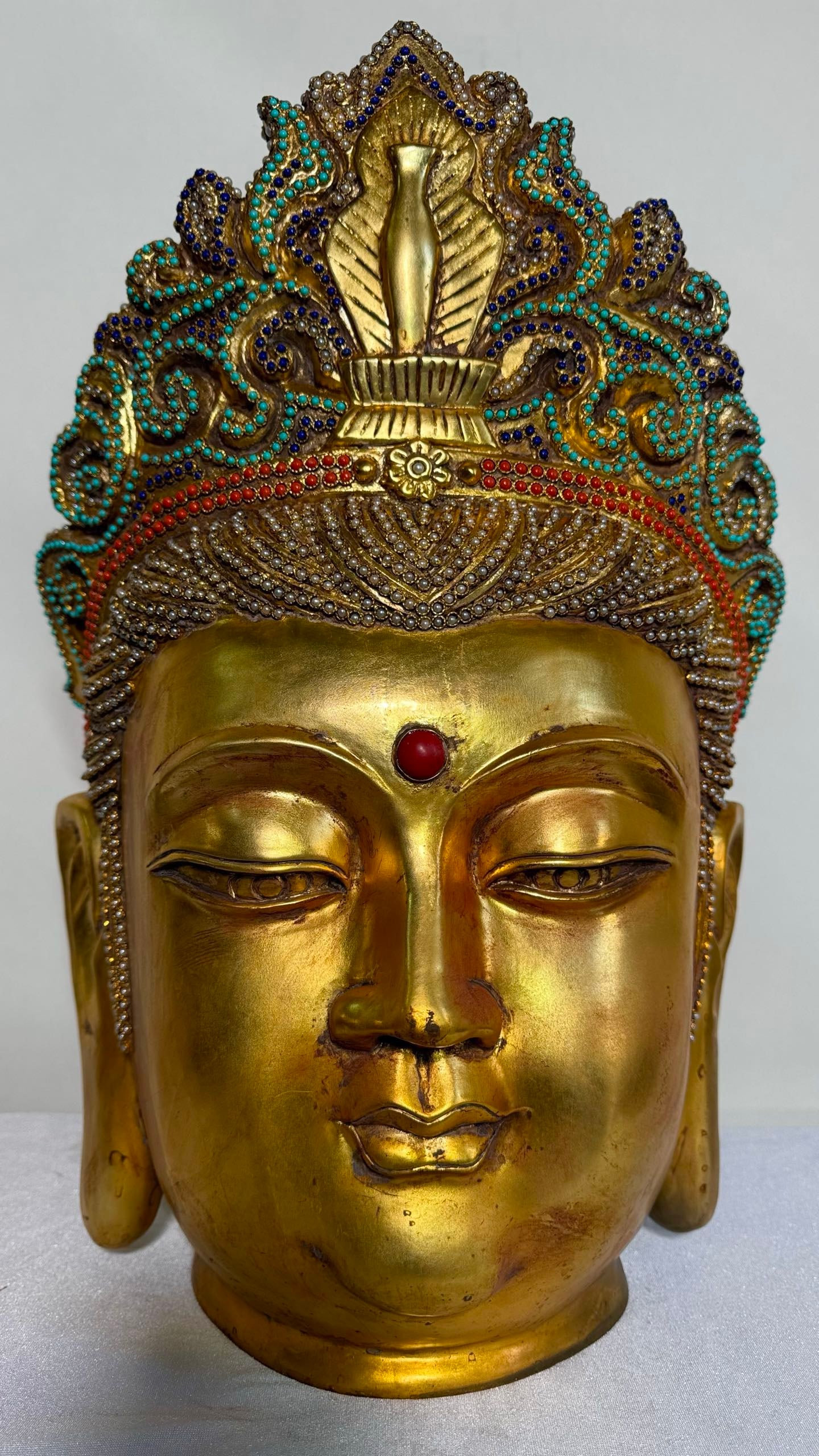 Gilded Guanyin Head Fully Inlaid with Pearls, Coral, Turquoise and Lapis Lazuli: Gilded Guanyin Head Fully Inlaid with Pearls, Coral, Turquoise and Lapis Lazuli, height 50cm, length 32cm, width 36cm. A Guanyin Bodhisattva crown statue from Tibetan Buddhist temples or the Qing cour