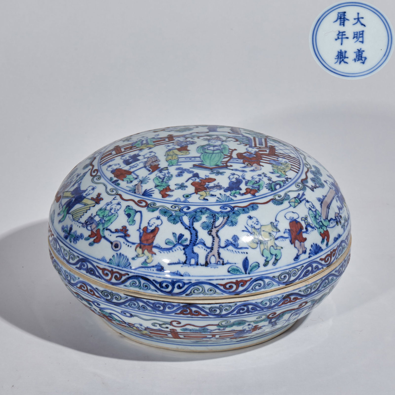 Wanli Period, Ming Dynasty Doucai Box with One Hundred Children Pattern: Ming Wanli Period Doucai Hundred Boys Round Box, height 13cm, diameter 25.5cm.