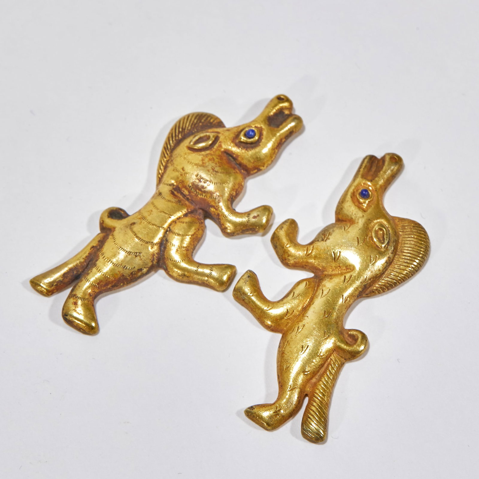 A Pair of Animal-Shaped Accessories: Animal Ornaments, Pair, Length 6cm, Width 2.9cm, 42g. Unearthed from aristocratic tombs of the Han, Tang or Liao Dynasty, ancient noble costume ornaments (belt buckles /plaques), representative of anc