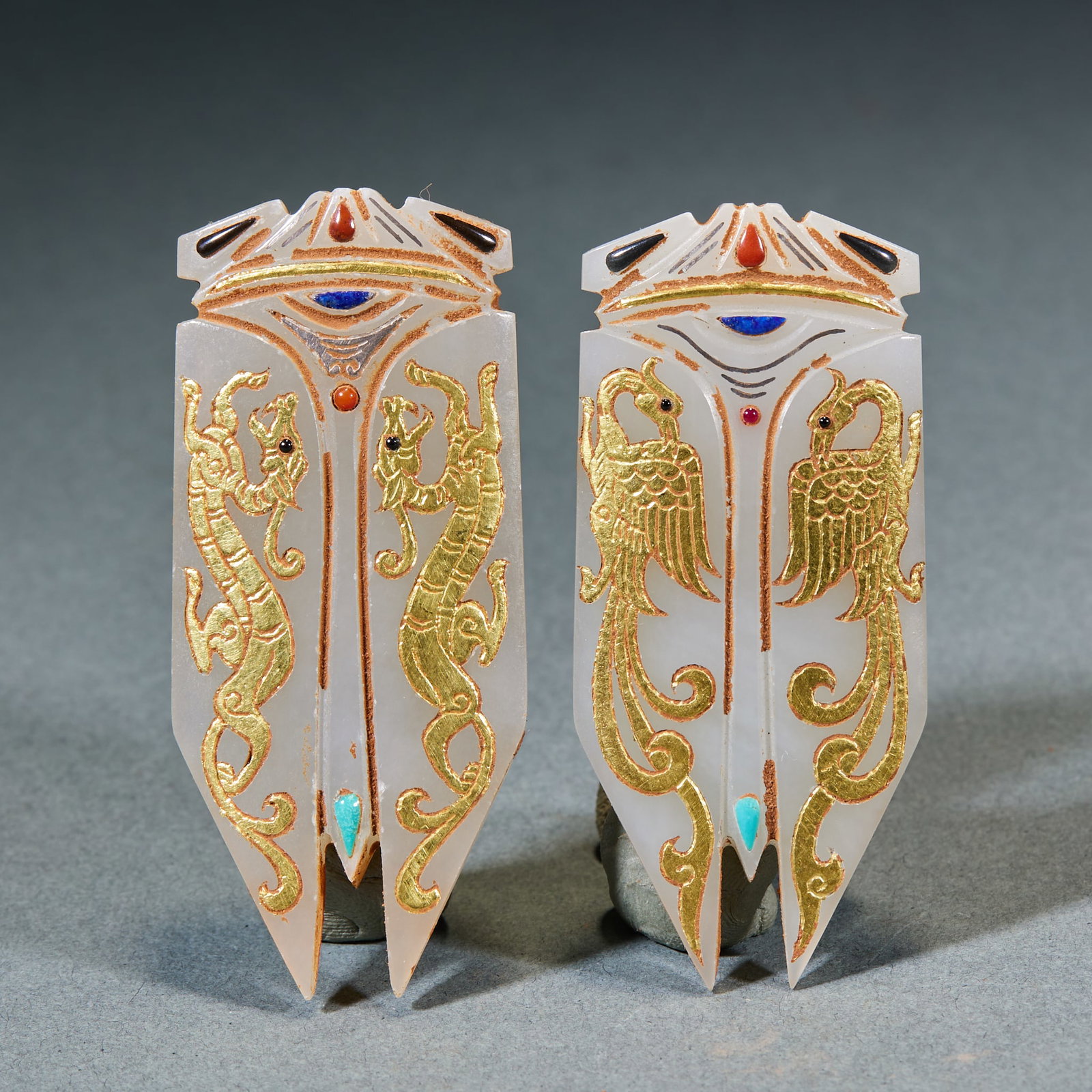 A Pair of Gold-Inlaid Jade Cicadas with Dragon & Phoenix Motifs: Pair of Gold-Inlaid Hotan Jade Dragon and Phoenix Cicadas, Length 6.5cm, Width 2.8cm, Weight 53g, Warring States–Han Period (Noble Jade of Central Plains Kingdoms, Excavated / Handed Down); natural