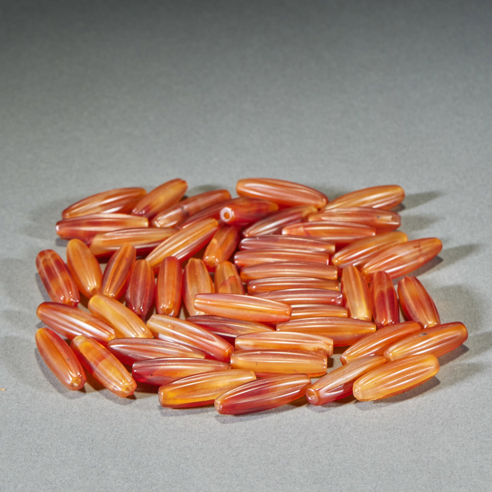 50 Long Edged Agate Beads: Fifty Agate Elongated Prismatic Beads. Length 2.9cm, Width 1cm. Archaic Period (Western Zhou / Warring States?Han, Ancient Pendant, Excavated / Heritage Piece). Material: Natural Red Agate (Sardonyx,