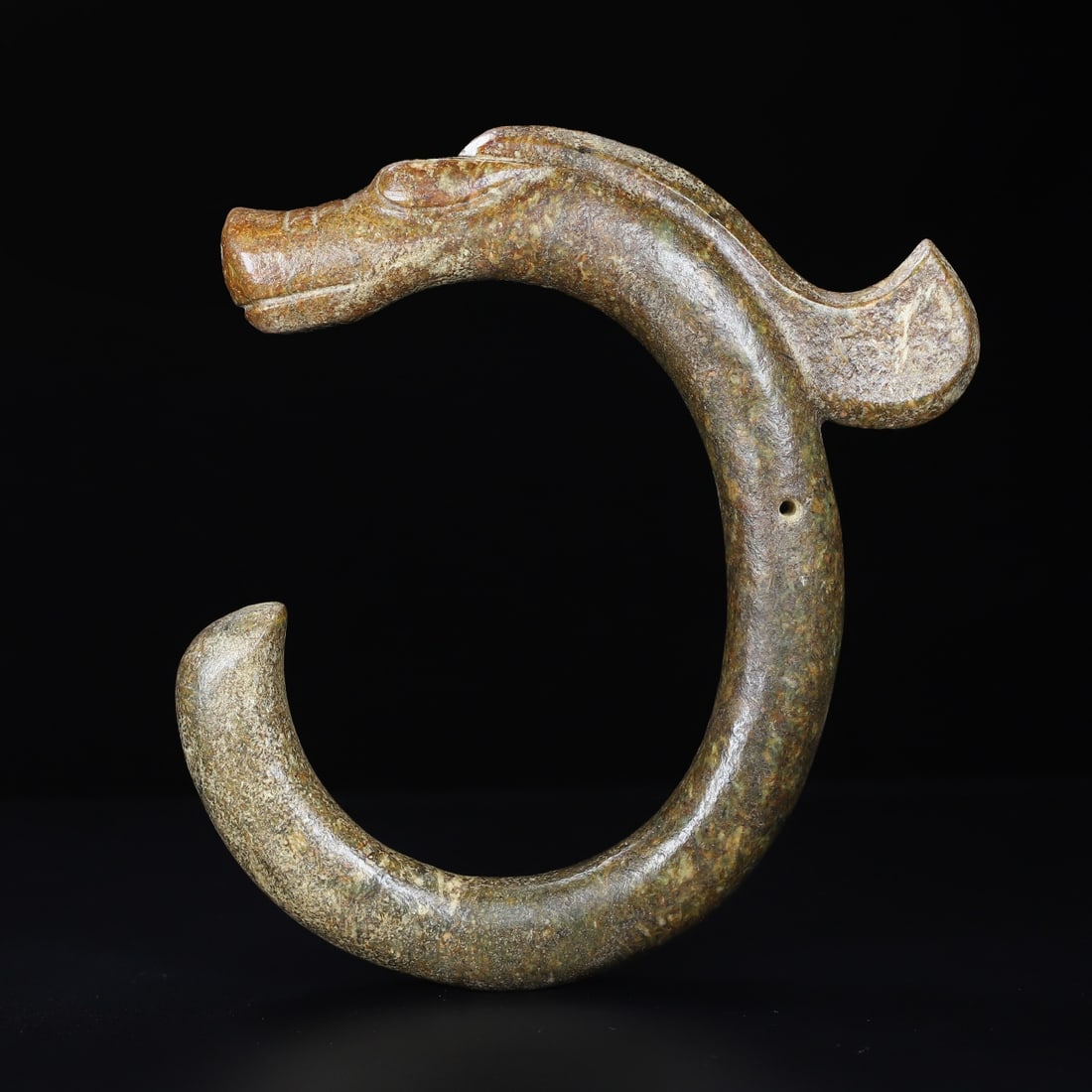 Hemo Jade C-Shaped Dragon: Hongshan Culture Hemo Jade C?Shaped Dragon. Length 25.2cm, Width 23.2cm, Thickness 3.2cm, 1331g. Hongshan Culture, Late Neolithic (Archaic Ritual Object, Excavated / Heritage Piece). Material: