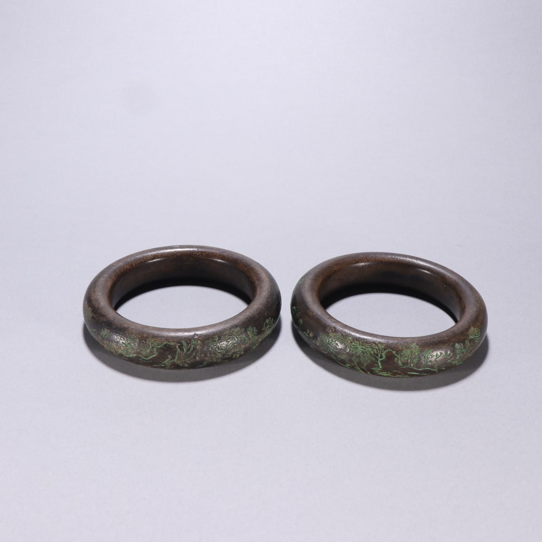 A Pair of Agarwood Carved Bracelets with Floral Patterns: Pair of Carved Agarwood Bracelets with Floral Patterns. Inner Diameter 6.7cm, Width 1.9cm, 109.3g. Qing Dynasty (Aristocratic Pendant, Heritage Piece, Pair). Material: Natural Agarwood (Sinking