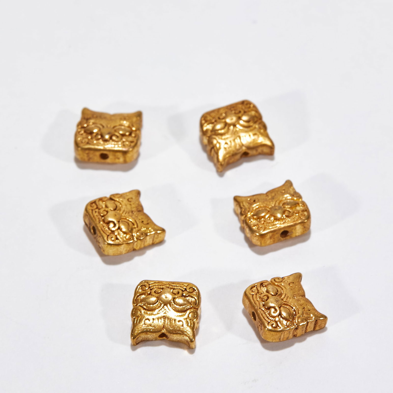 Tiger-Head Spacer Bead: Gold Tiger-head Spacer Beads, Warring States-Liao-Jin Periods, H.1cm W.1cm 13g. Ancient ornamental beads, unearthed or handed down, complete set; pure gold; cast in high relief with tiger-head motifs,