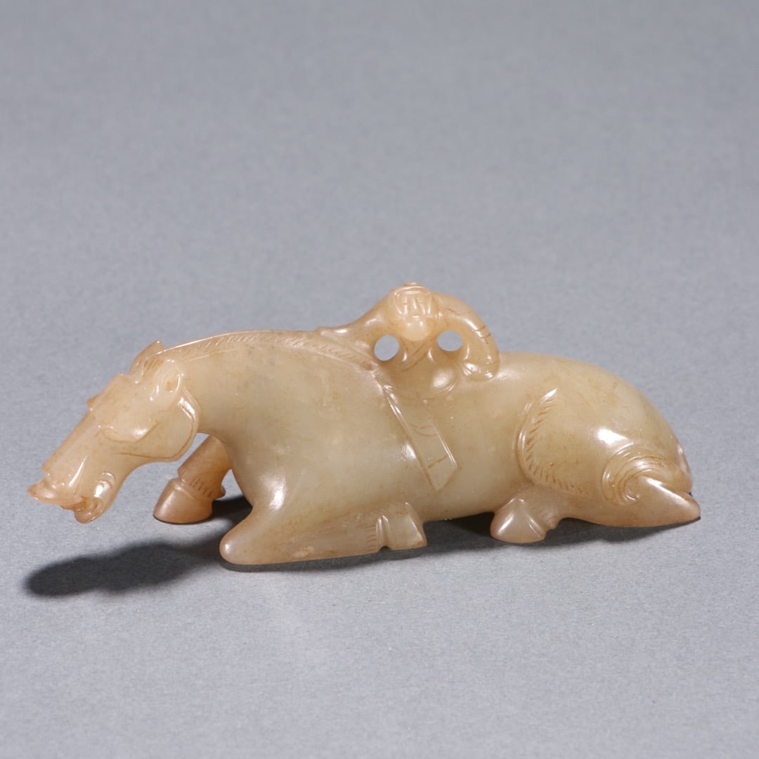 Hetian Jade Figure of a Foreigner Taming a Horse, Han Dynasty: Han Dynasty Hotan Jade Ornament of Barbarian Taming Horse, H.3.8cm W.10cm 98g. Ancient jade display or ornament, unearthed or handed down; natural Hotan sugar white jade of fine and moist texture;
