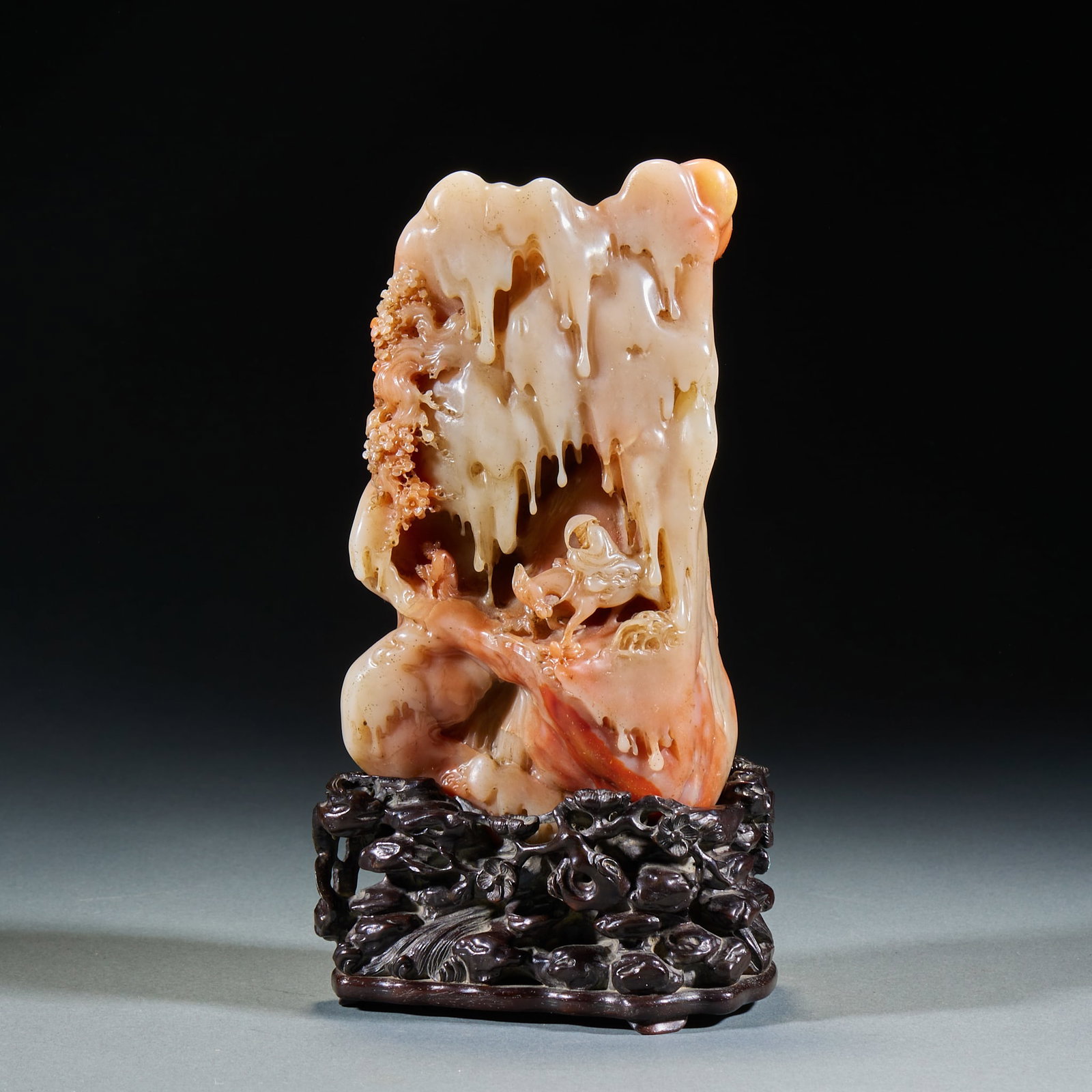 Shoushan Furong Stone Carving of 'Seeking Plums in Snow': Shoushan Furong Stone Ornament of Seeking Plum Blossoms in Snow, Qing Dynasty-Modern Times, H.23cm L.12cm W.8cm. Shoushan stone display piece, handed down with rosewood base; natural Shoushan furong
