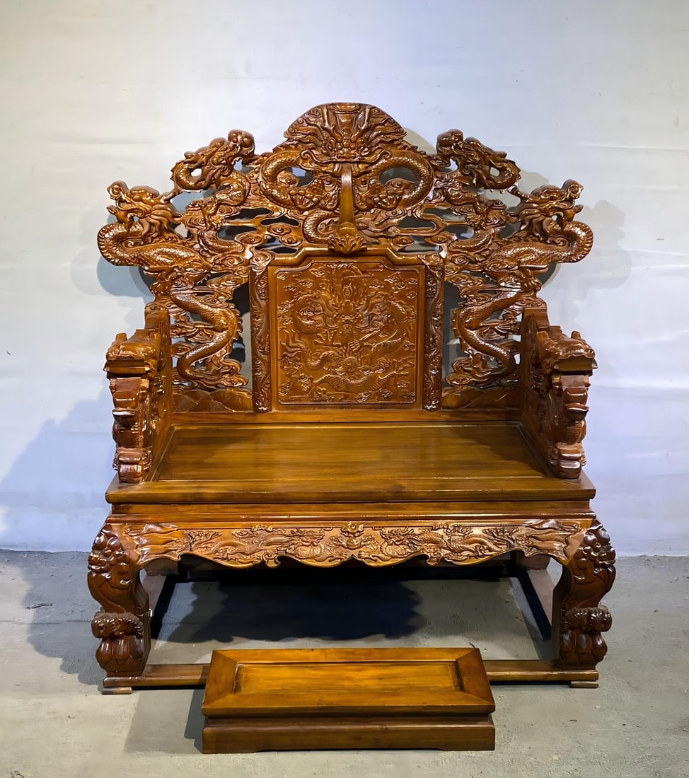 Huanghuali Throne with High-Relief Carvings: High-relief Huanghuali Wood Imperial Throne with Backrest, Qing Dynasty, H.151cm L.125cm W.75cm Footrest 70?30?12cm. Imperial or mansion furniture, handed down with footrest; Hainan yellow pear wood