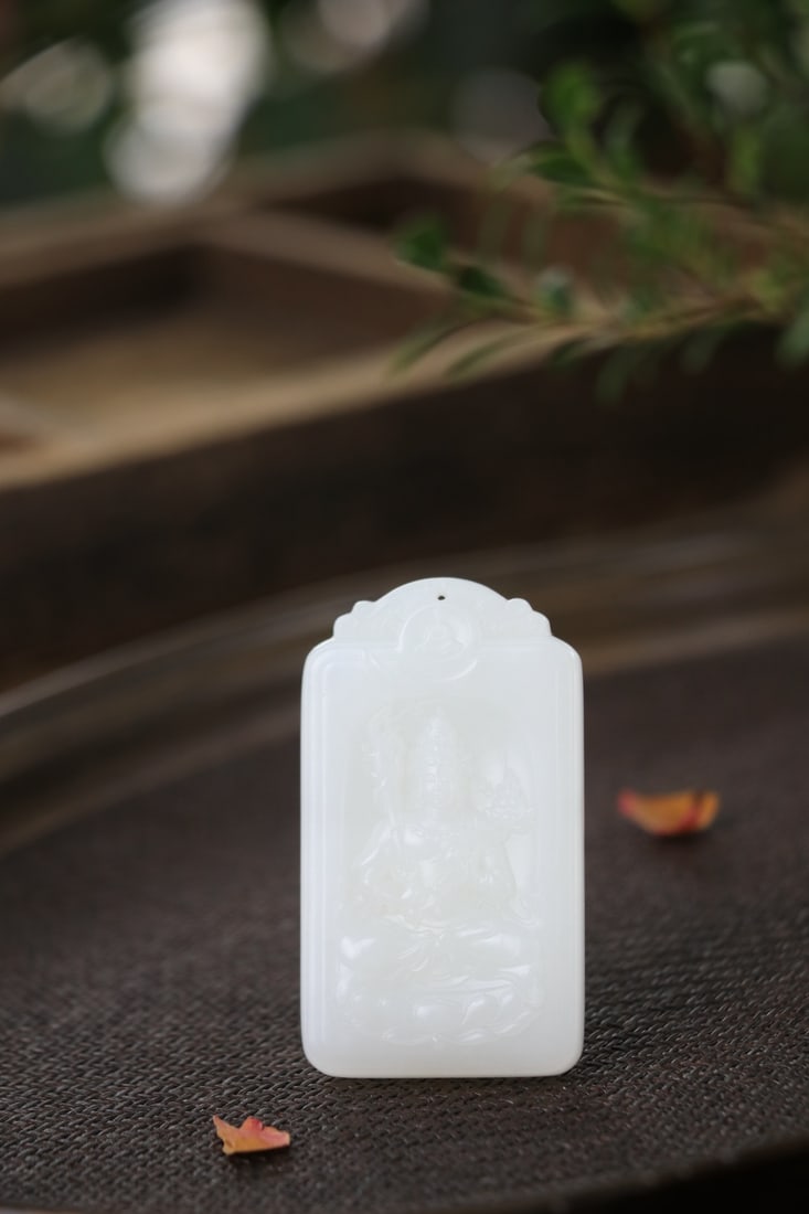 Hetian Jade Mountain Material, Suet White Jade Statue of Akasagarbha Bodhisattva: One Hotan jade mountain material Akashagarbha Bodhisattva plaque, L. 5.8cm, W. 3.3cm, 45g, Qing Dynasty/Modern period (Hotan jade ornament/ritual object, hereditary); natural Hotan jade mountain