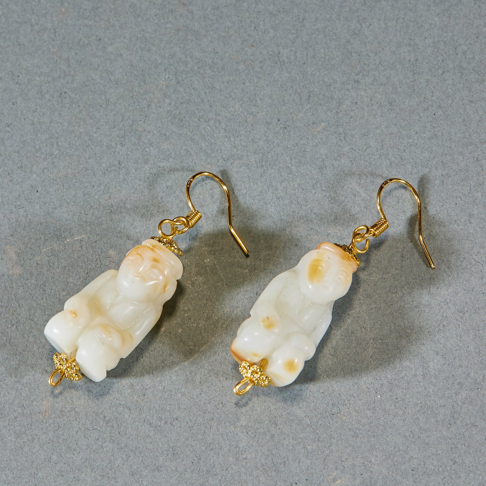 Pair of Hetian Jade Boy Earrings: Pair of Hetian Jade Boy EarringsH 2.5 cm, Diam. 1.3 cm