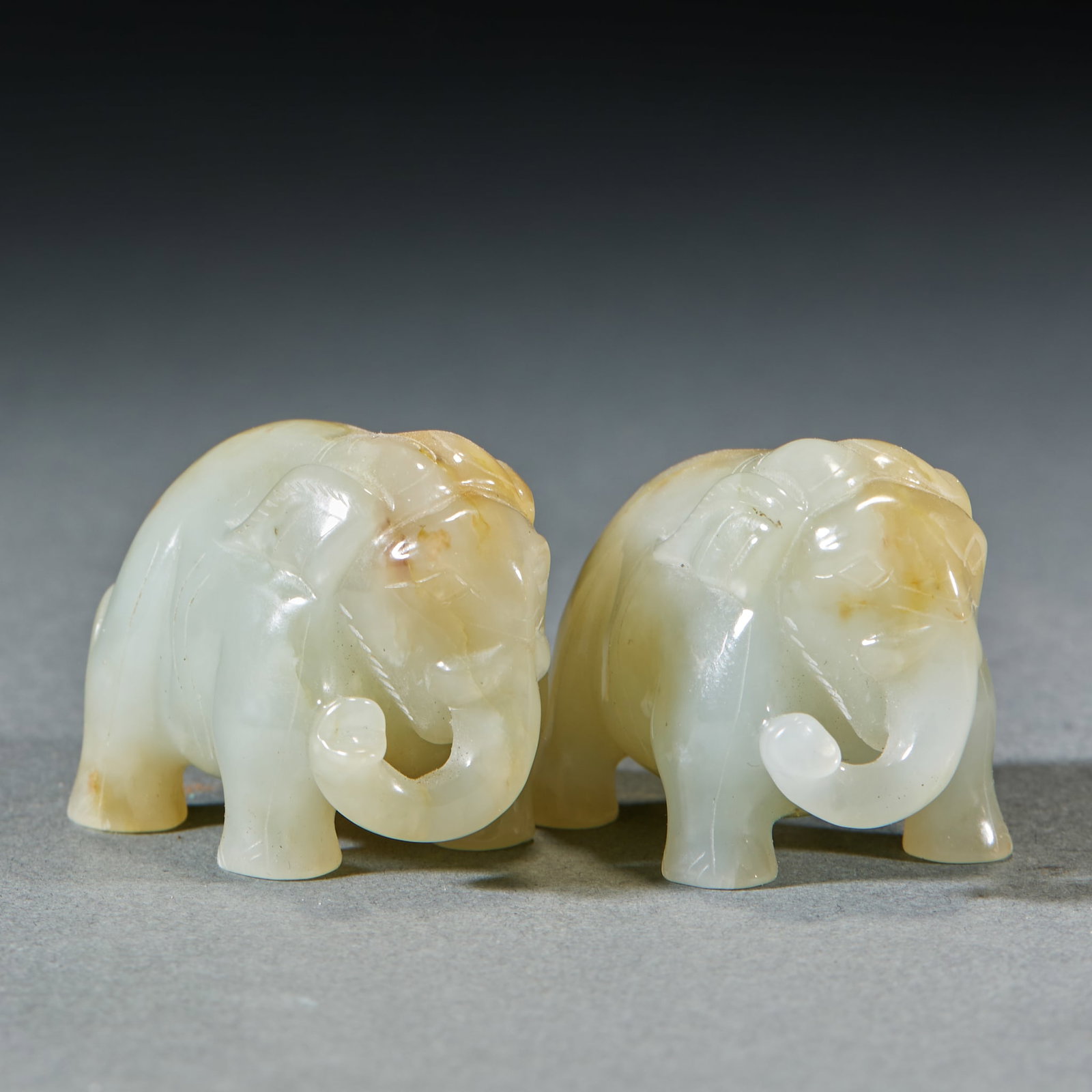 Pair of Hetian Jade Ornaments: Elephants Symbolizing Peace & Abundance: Pair of Hetian Jade Ornaments: Elephants Symbolizing Peace & AbundanceH 3 cm, L 4 cm, W 3 cm