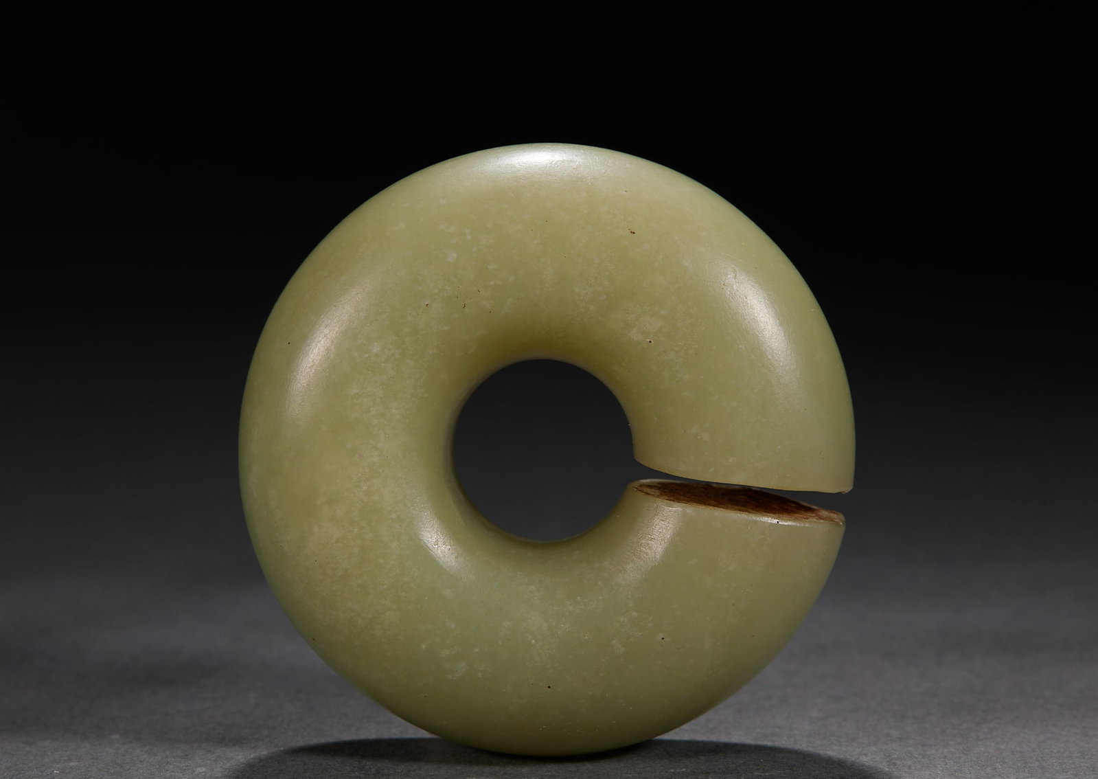 Hongshan Culture Jade Jue Slit Disc: Hongshan Culture Jade Jue Slit DiscThickness 2.1 cm, Diam. 5.5 cm