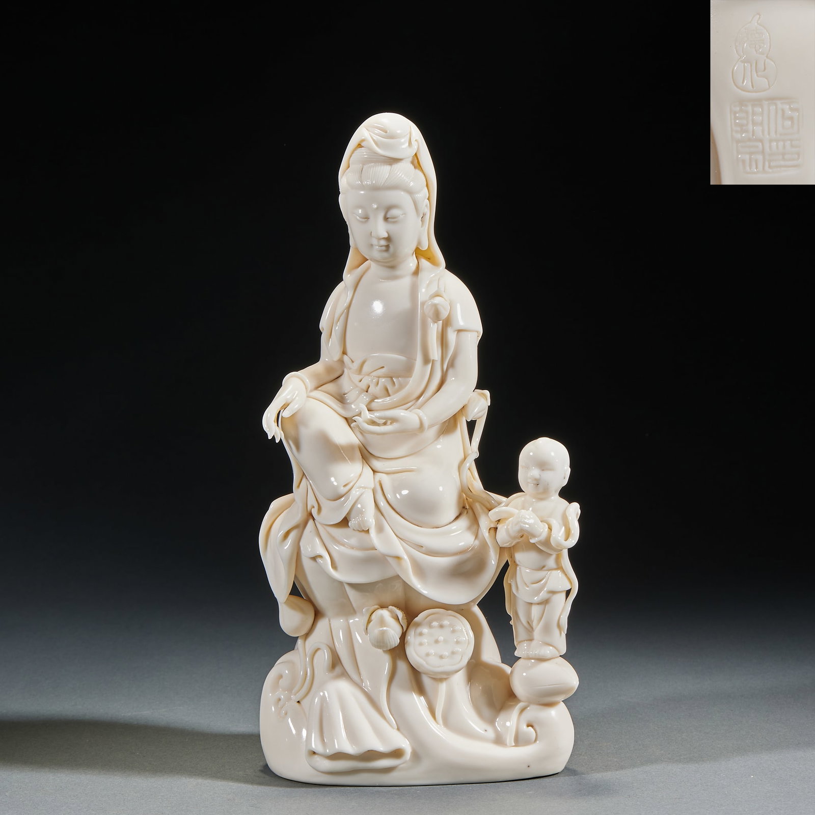 Dehua Kiln Guanyin Bringing Sons Statue, Signed He Chaozong: Dehua Kiln Guanyin Bringing Sons Statue, Signed He ChaozongH 27 cm, L 12 cm, W 9 cm