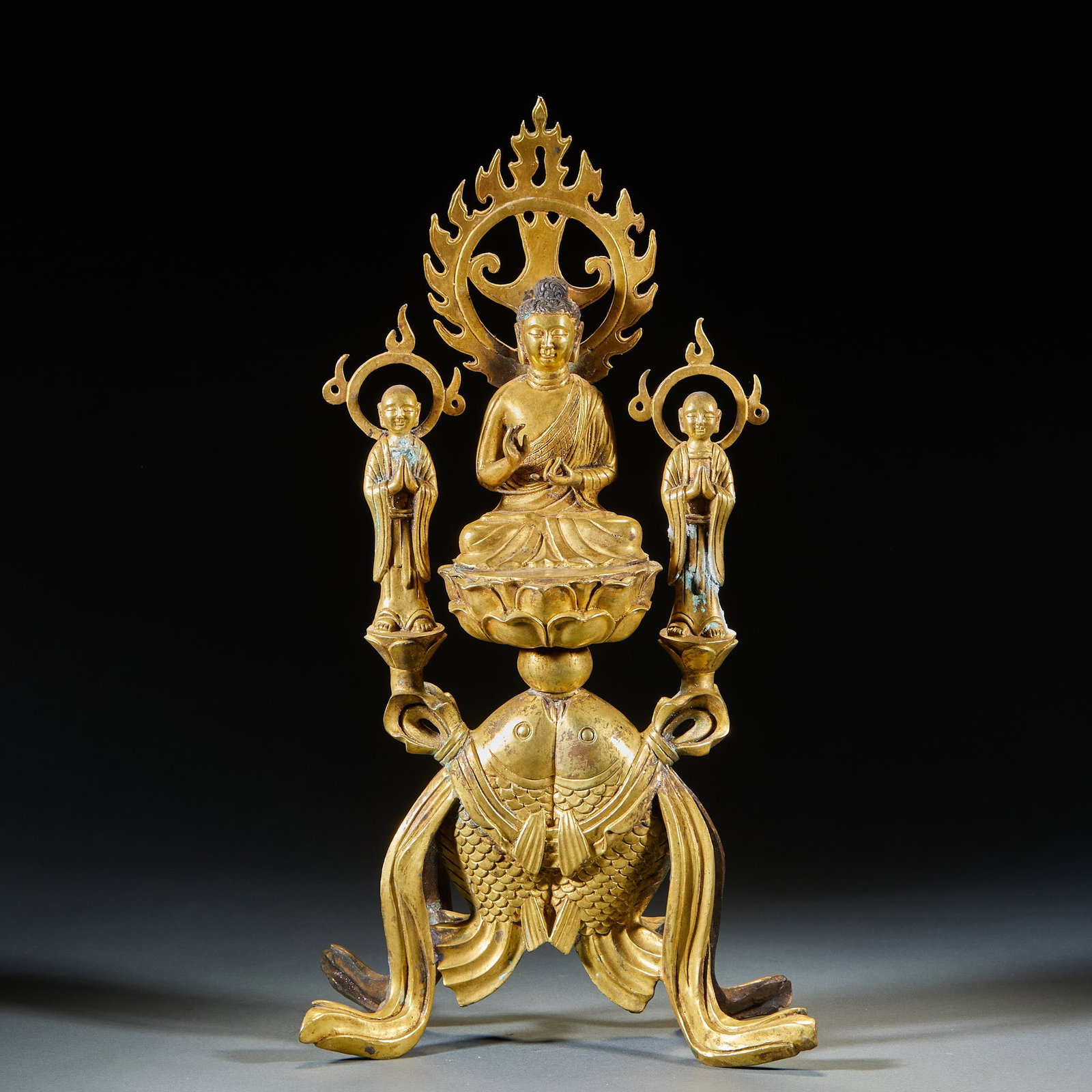 PreMing Gilt Bronze Buddha Group: One Buddha with Two Disciples & Twin Fish Motifs: PreMing Gilt Bronze Buddha Group: One Buddha with Two Disciples & Twin Fish MotifsH 43 cm, L 23 cm, W 13 cm