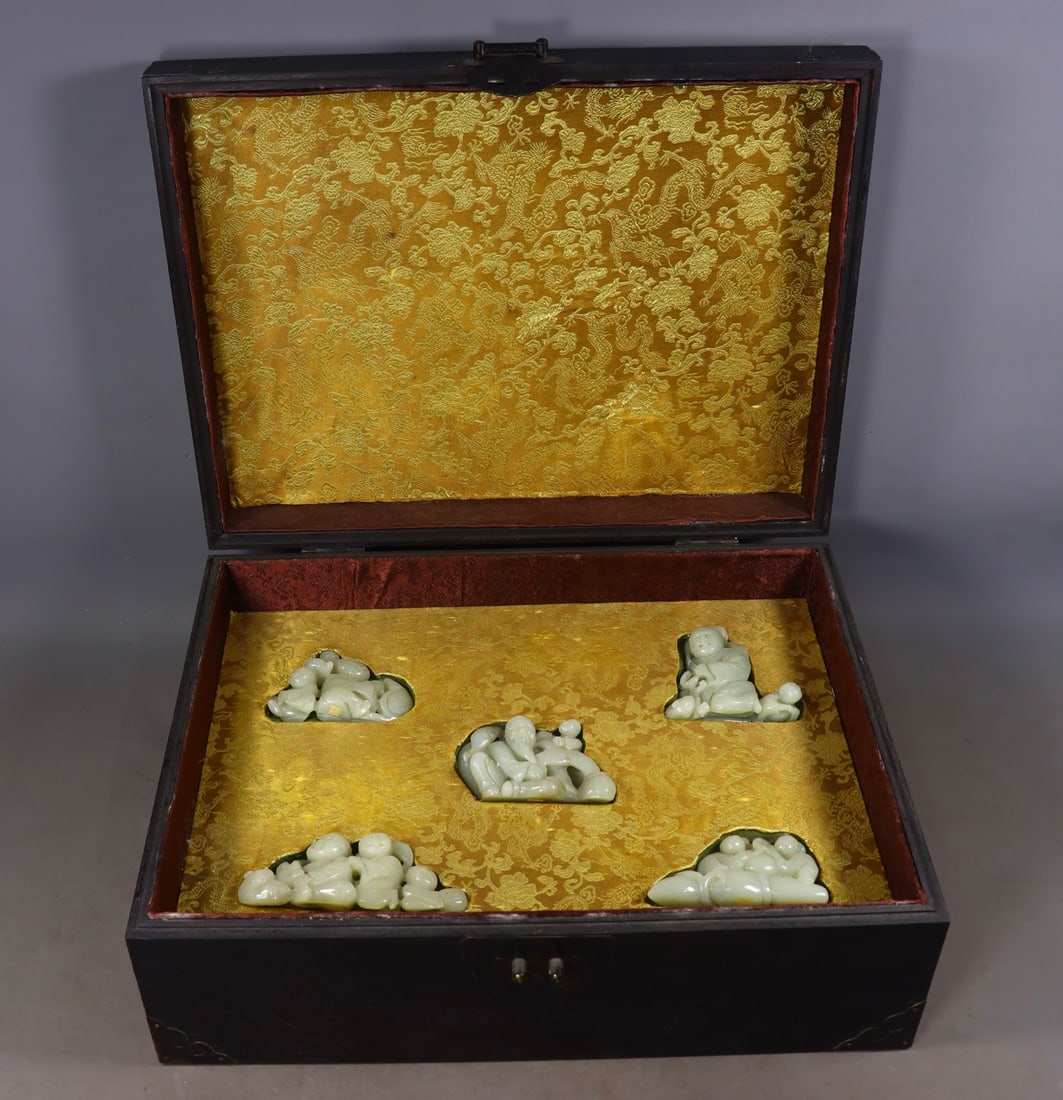 Crate of Qing Hetian Jade Handheld Ornaments: Crate of Qing Hetian Jade Handheld OrnamentsFisherman Figurine 1: H 6.5 cm, L 9.5 cm, W 5 cm; Fisherman Figurine 2: H 8.5 cm, L 8.5 cm, W 3.5 cm